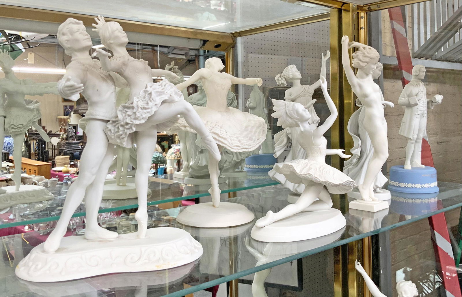 Lot of 7 White Bisque Porcelain Figurines, AS IS.: Three are Wedgwood, two are Boehm, one is Hutschenreuther, and one is Stuart Mark Feldman. The tallest figurine measures 10 1/2". The Wedgwood figures include two "Three Graces" ladies, as well as a J