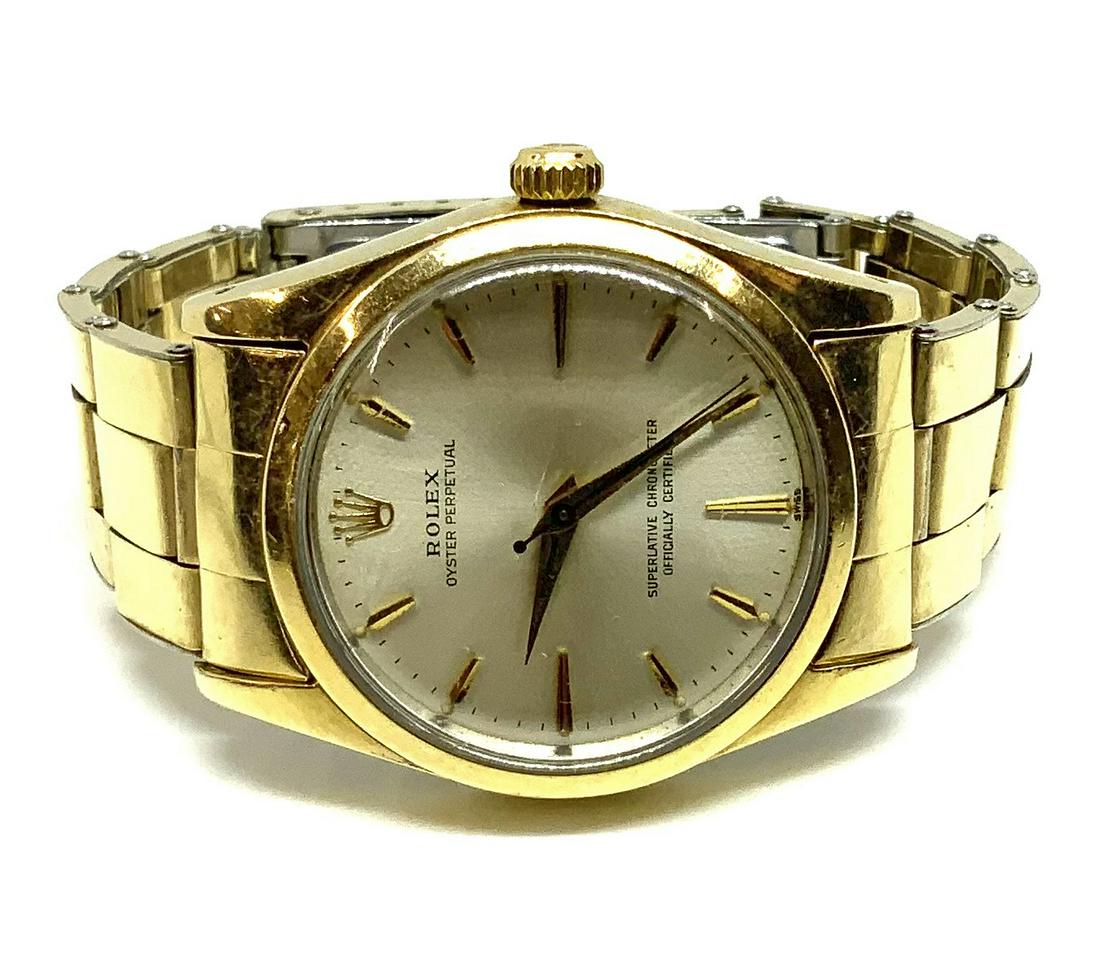 1972 Rolex Oyster Perpetual Gold Cap Men's Watch.: With the Original Rolex Band. The Band has some Scratches, and is missing the Springs for one of the Links. The Band is for a Pretty Small Wrist, about 6 1/2" Circumference. The Vintage 14K Gold Cap W