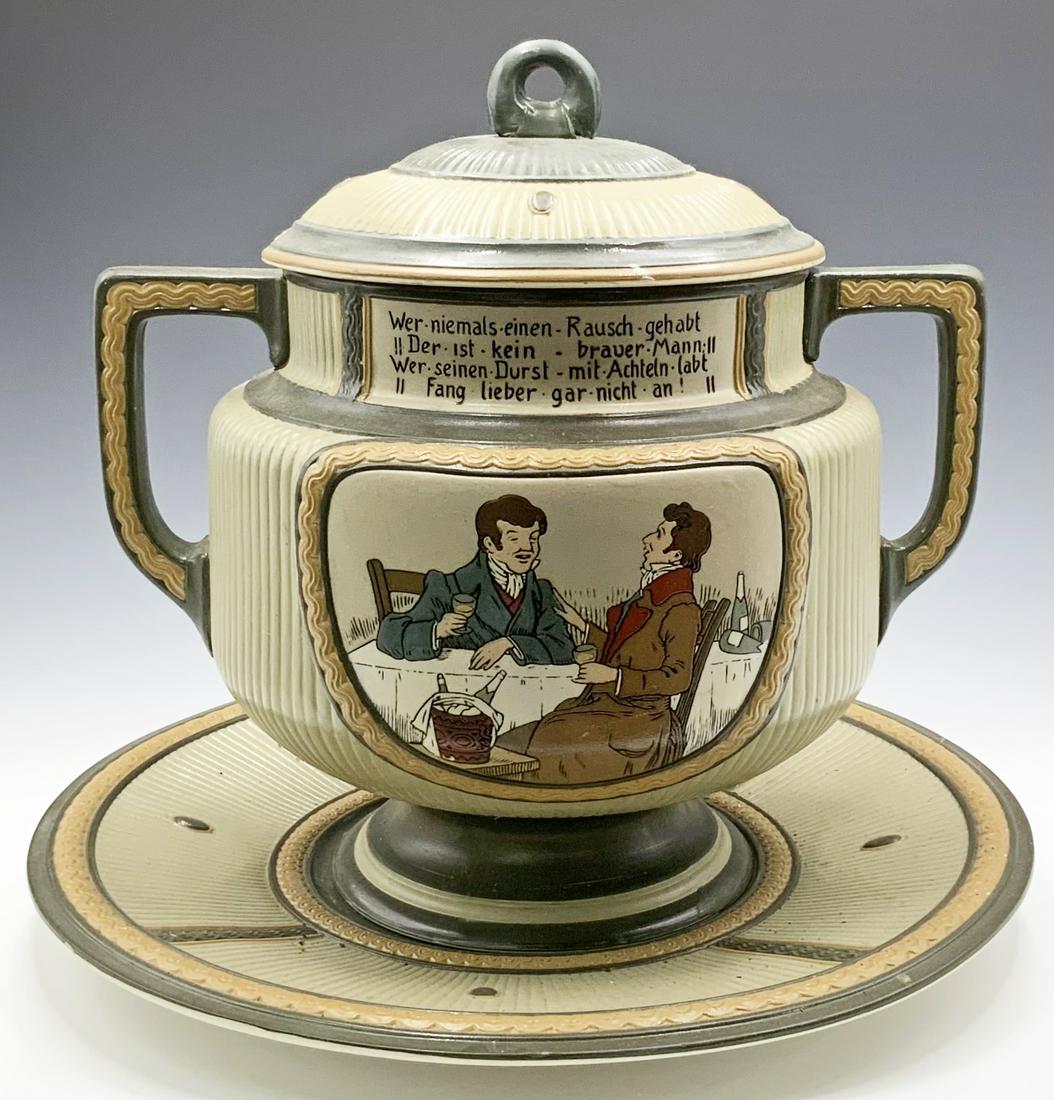 Lot of 3 Mettlach Pcs.: Tureen, Platter, Charger.: The tureen and platter go together. The tureen has illustrated dining scenes on both the front and back, and measures 13" tall. The platter is 15 1/4" in diameter. The Holy Family charger comes with t