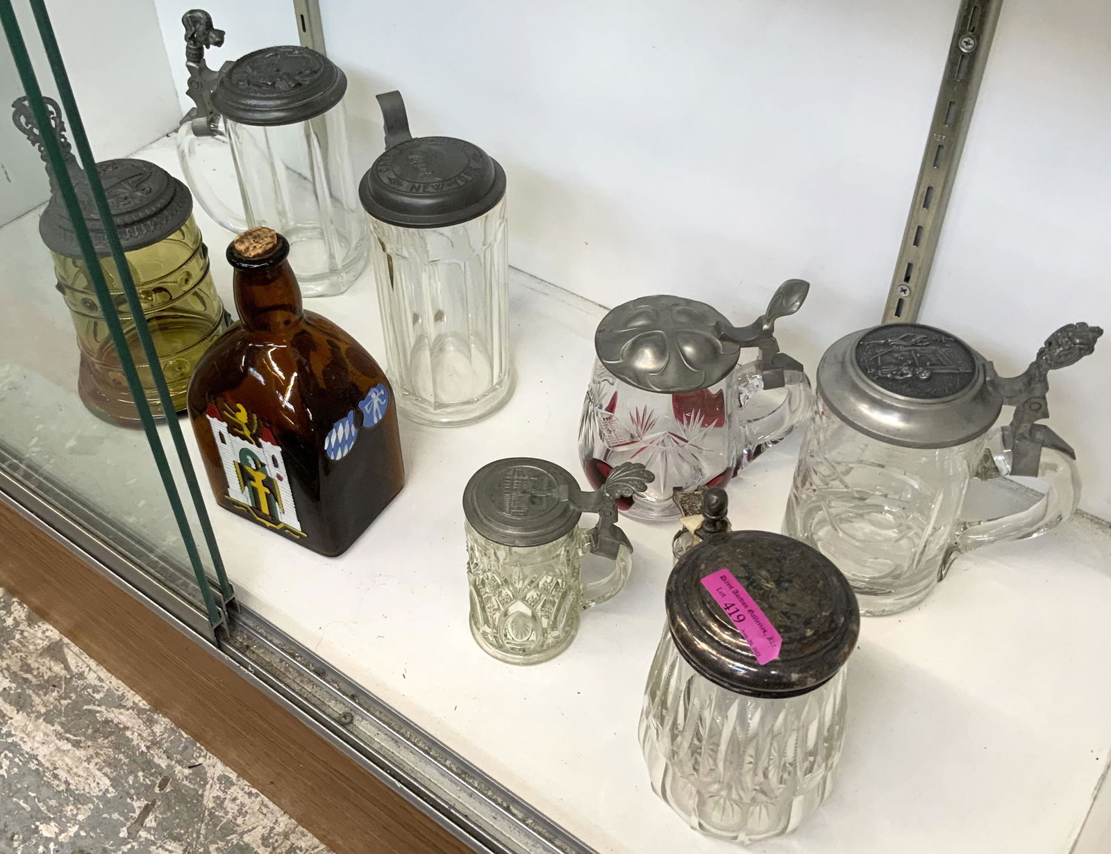 Lot: Assorted Glass Steins, Antique Liquor Bottle. (1 of 1)