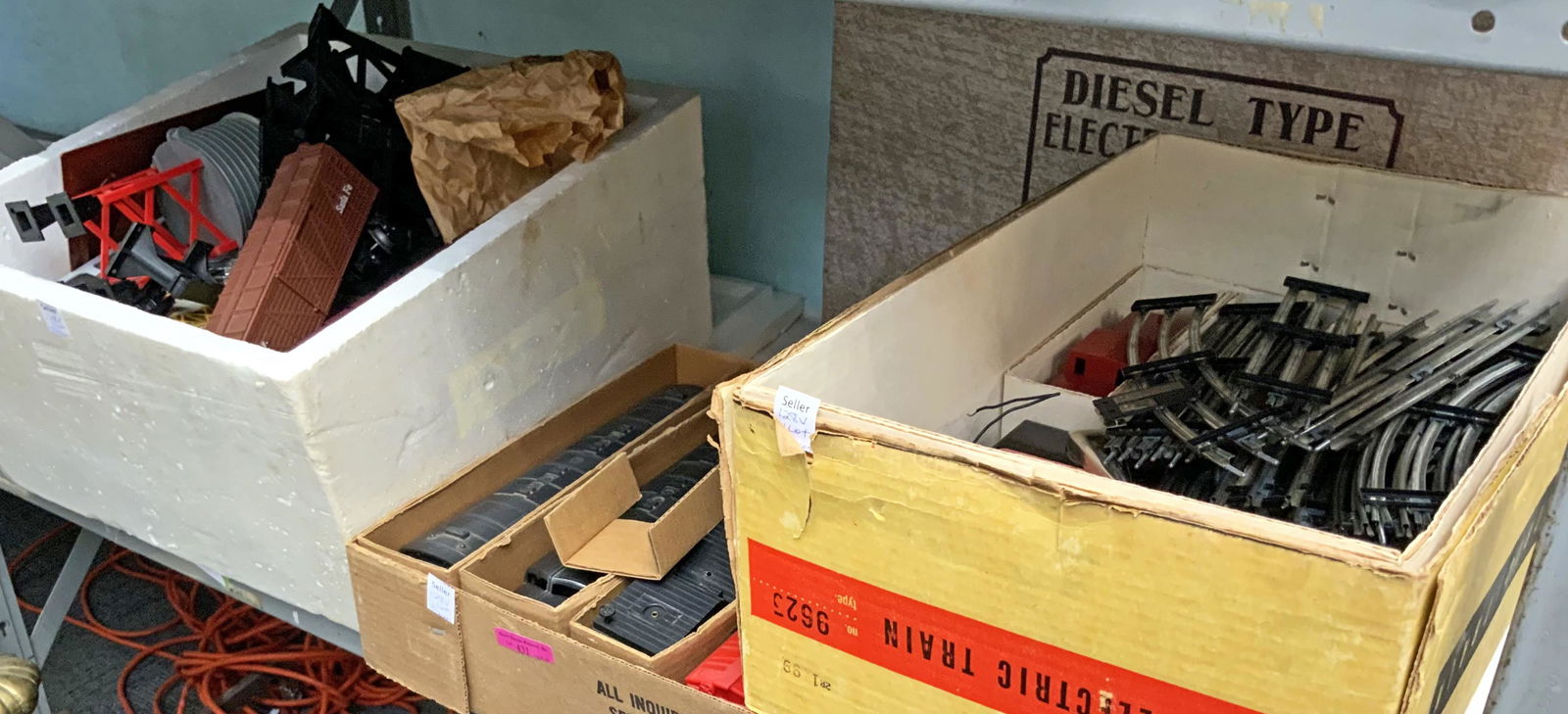 3 Boxes of Toy Trains and Accessories.: Two Boxes look to be by Marx, and there is one Train Set by Allstate. Includes train cars, transformers, tracks, etc. None of these items has been tested. Some of the cars are marked Missouri Pacific,