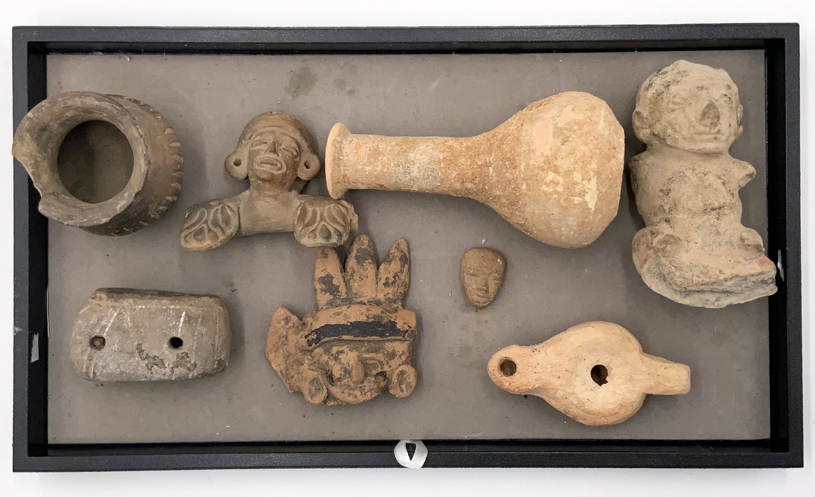 Lot of 8 Pre-Columbian Figures, etc.: Looks they may be Central or South American. Age is unknown. The largest piece measures 5 1/4" long. The Display Tray is not Included. Third-Party Shipping or Personal Pickup Required.