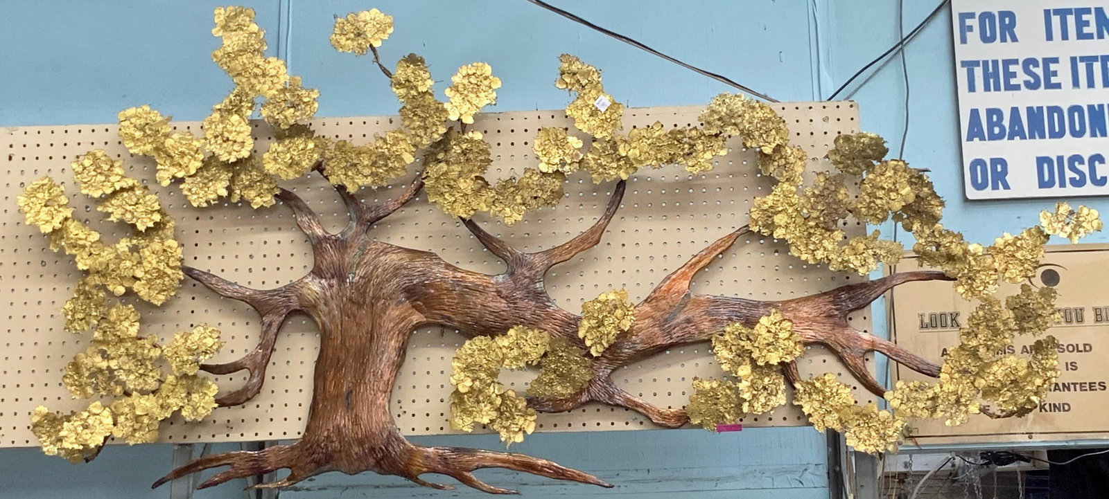Large Painted Metal Wall Sculpture of a Tree.: We are told by the Consignor it was signed, but we could not Find the Signature. The Sculpture measures 76" x 35", and it has some bent leaves. It could also use a gentle cleaning. Third-Party Freight