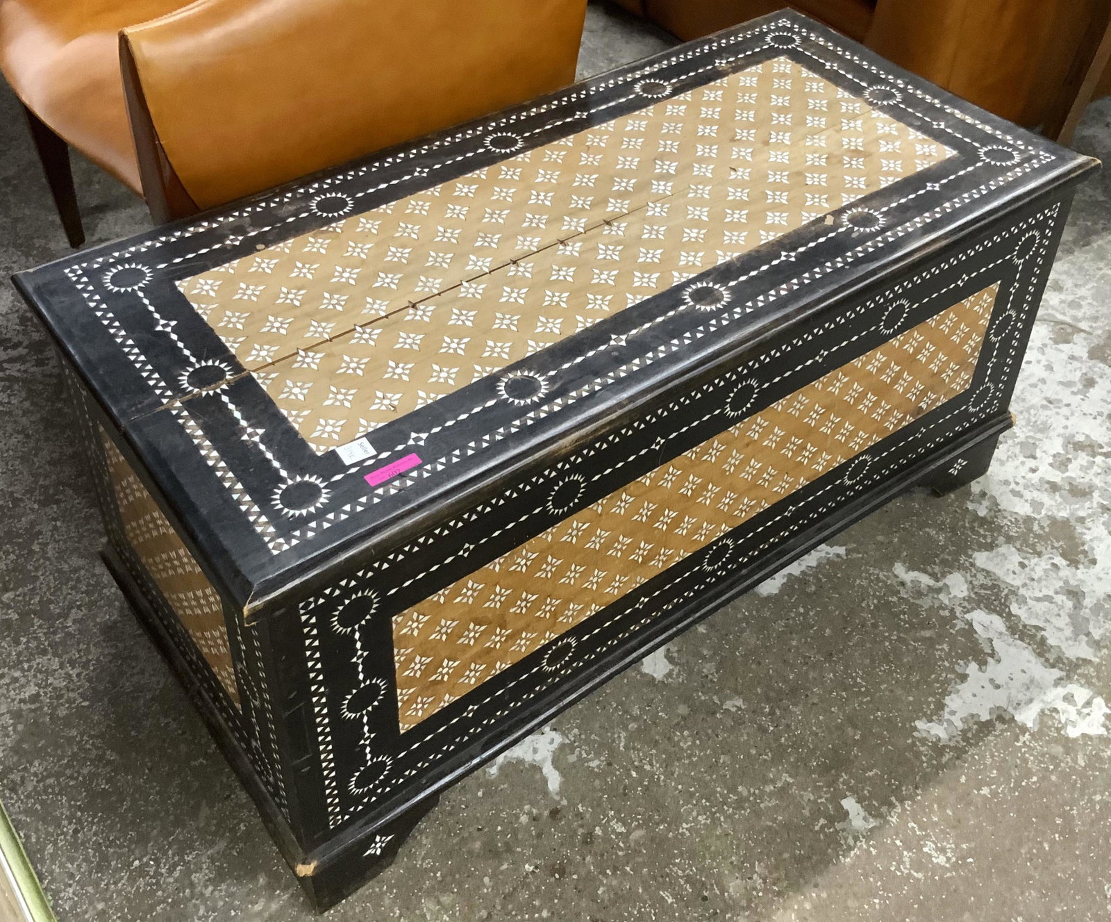 Mother-of-Pearl Inlaid Lift-Top Chest / Trunk.: This unique chest has 2 colors of wood and Mother-of-Pearl stars inlaid in the light wood panel, and a Mother-of-Pearl design and border inlaid into the dark wood. There is a split along the grain of 