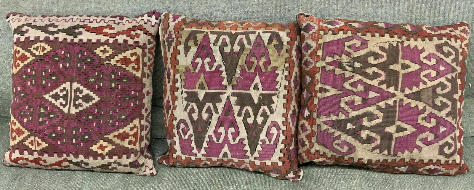 Lot of 3 Kelim Oriental Rug Pillows.: These pillows are made from Kilim Rugs and have great designs on them. They are used and show some signs of wear, but are totally useable as they are. The Largest Pillow measures 18" by 18".