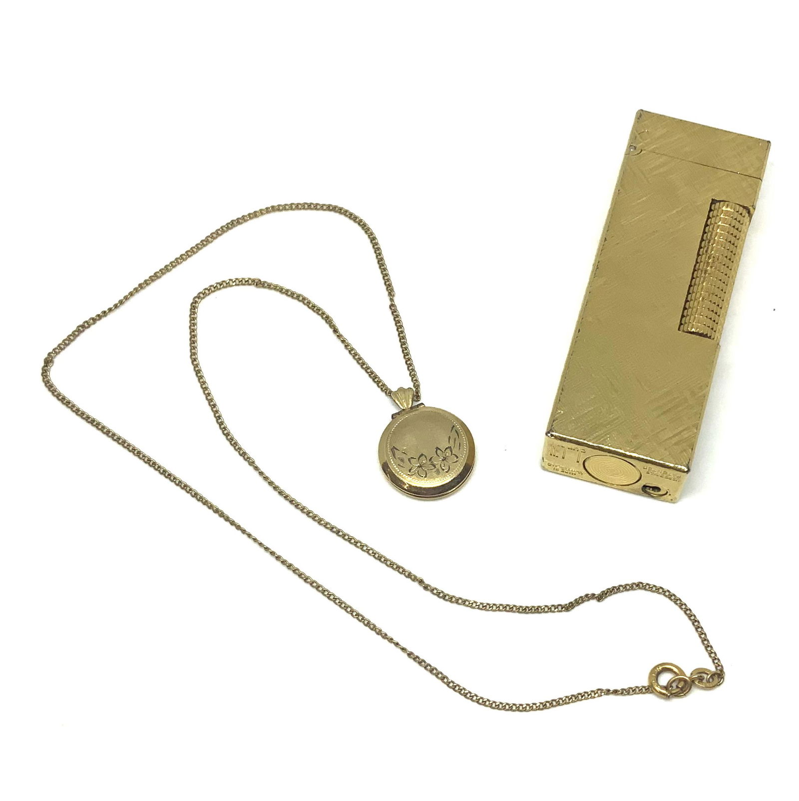 Dunhill Lighter & Gold-Filled Chain w/Locket.: The Lighter is Gold-Plated. The Exterior is in Good Condition. The Lighting Mechanism does not Work. The Lighter measures 2 1/2" Long. It comes with a Gold-Filled Chain with a Small Antique Locket. Th