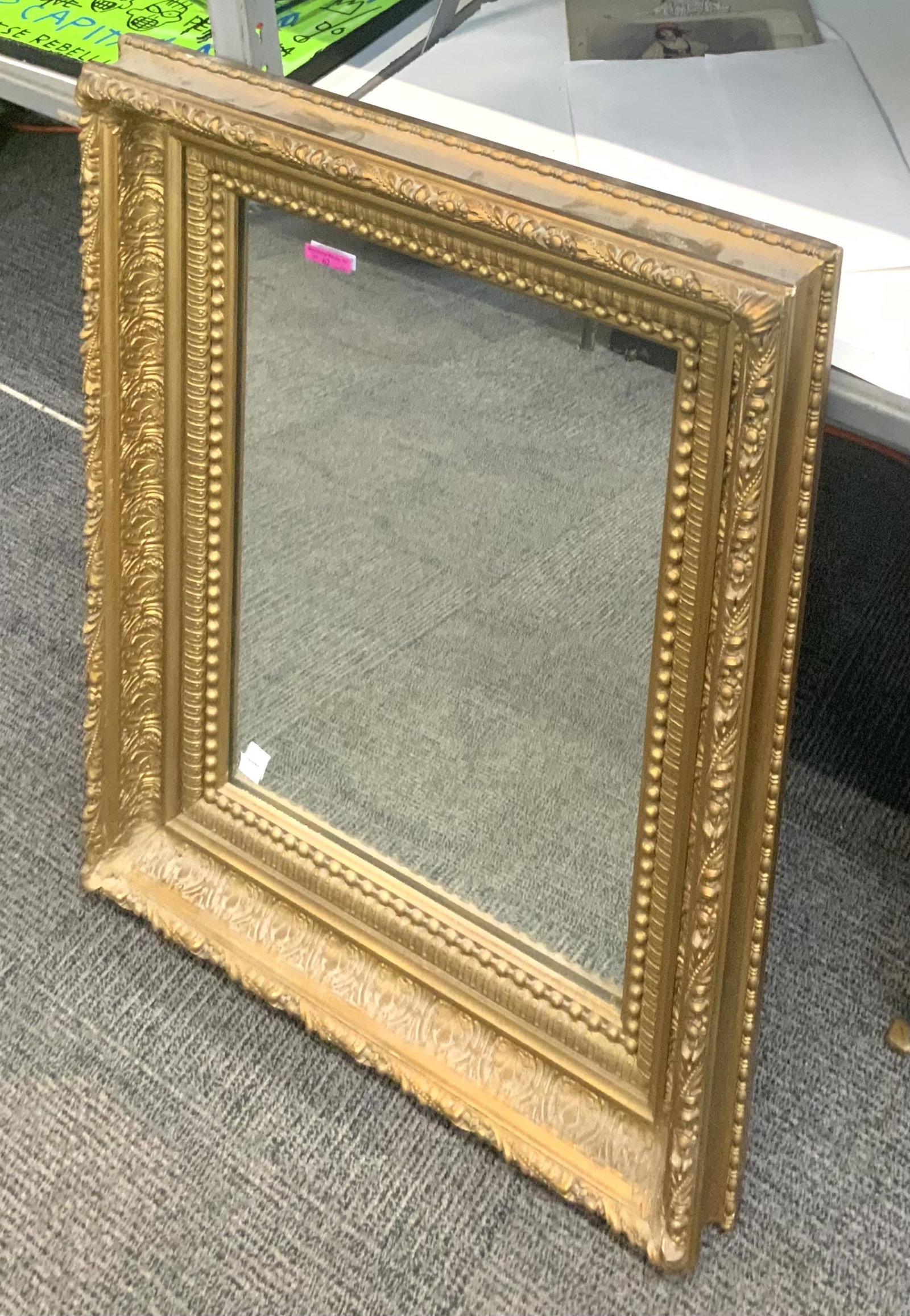 Antique Rectangular Mirror in Ornate Frame.: This mirror is in overall good condition. It measures 24" wide, 3" deep, and 30" long. Third Party Shipping or Personal Pickup Required.