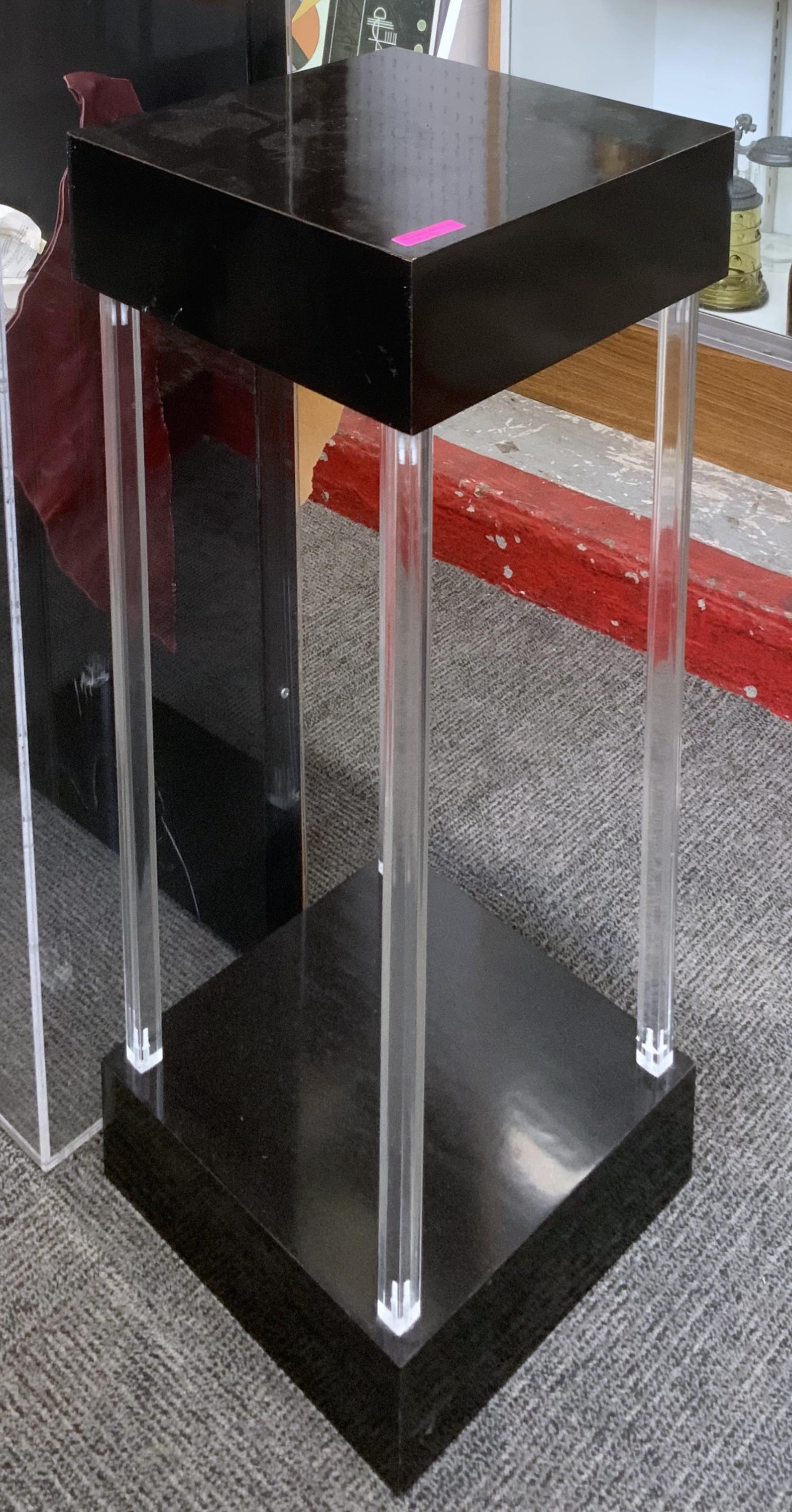 Black and Clear Lucite Pedestal.: The Contemporary Display Pedestal measures 12" by 12", and 32" tall. Third Party Freight Shipping or Personal Pickup is Required.