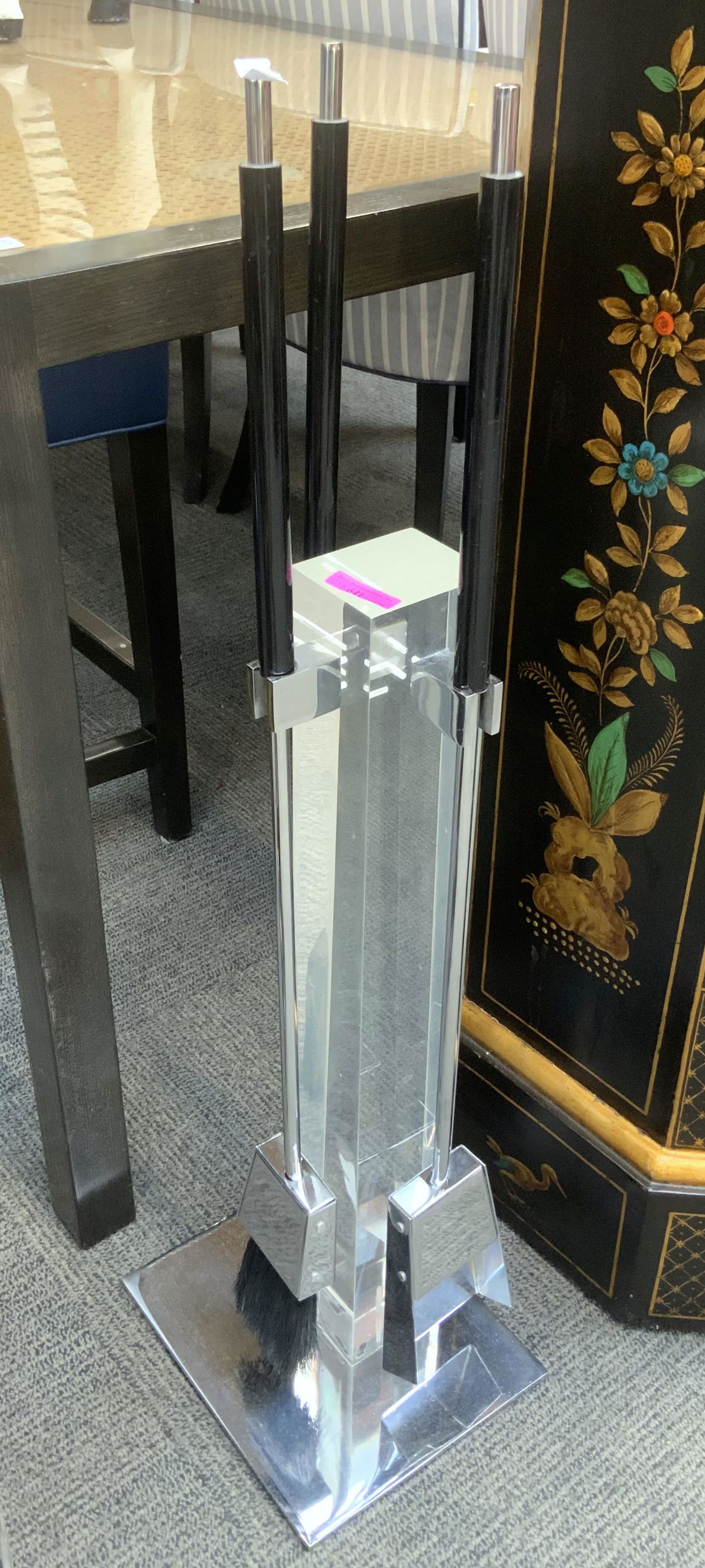 Moderne Chrome and Lucite Fireplace Tool Set.: This set includes a chrome shovel, brush and poker, mounted on a lucite post, sitting on a chrome base. The lucite post measures 24 1/2" tall, and the chrome base is 9" square. Third Party Freight Shi