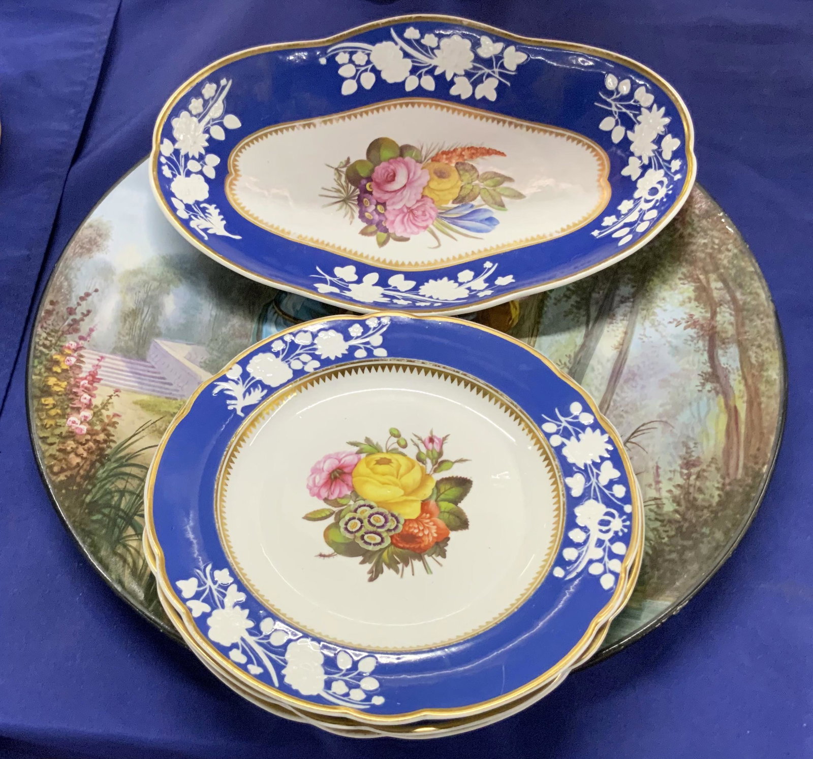 Lot: F.B. Paris Charger, Spode Floral Plates.: The Lot consists of Three 8 1/2" Spode plates, a longer dish of the same pattern that measures 11 1/2" across, and a Charger with a Courting Scene. The Charger is marked "F.B. Paris Premier Pas" on th