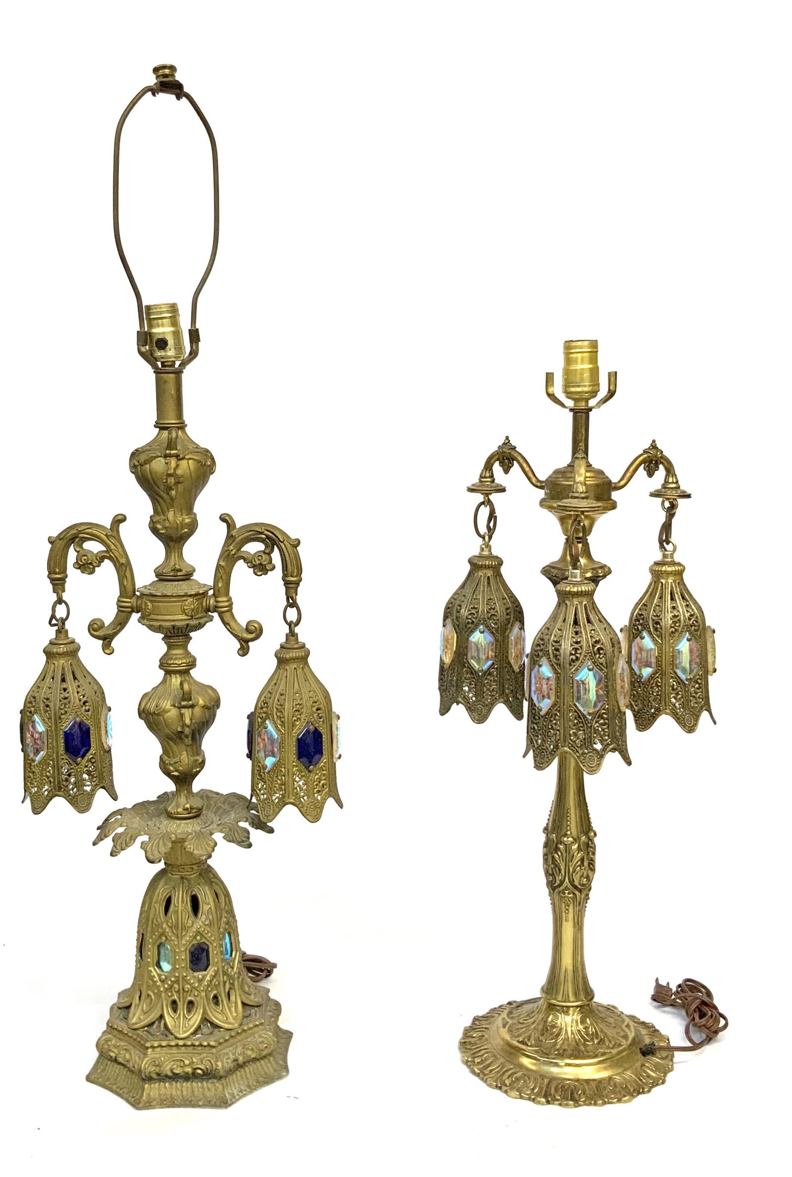 Lot of 2 Hollywood Regency Brass Lamps.: One is a two-arm lamp, the other has three arms. Only the two-arm lamp has a harp. It is the Taller lamp, at 38" tall, 13" across. The hanging shades have iridescent Prisms on the outside. Third-Party