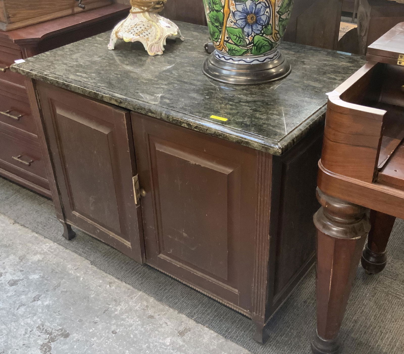 2-Door Cabinet w/Green Granite Top.: The Cabinet has Lots of Wear on the Doors. It measures 28 1/2' Tall, 38 1/2" Wide, and 25 3/4" Deep. Third-Party Freight Shipping or Personal Pickup Required.