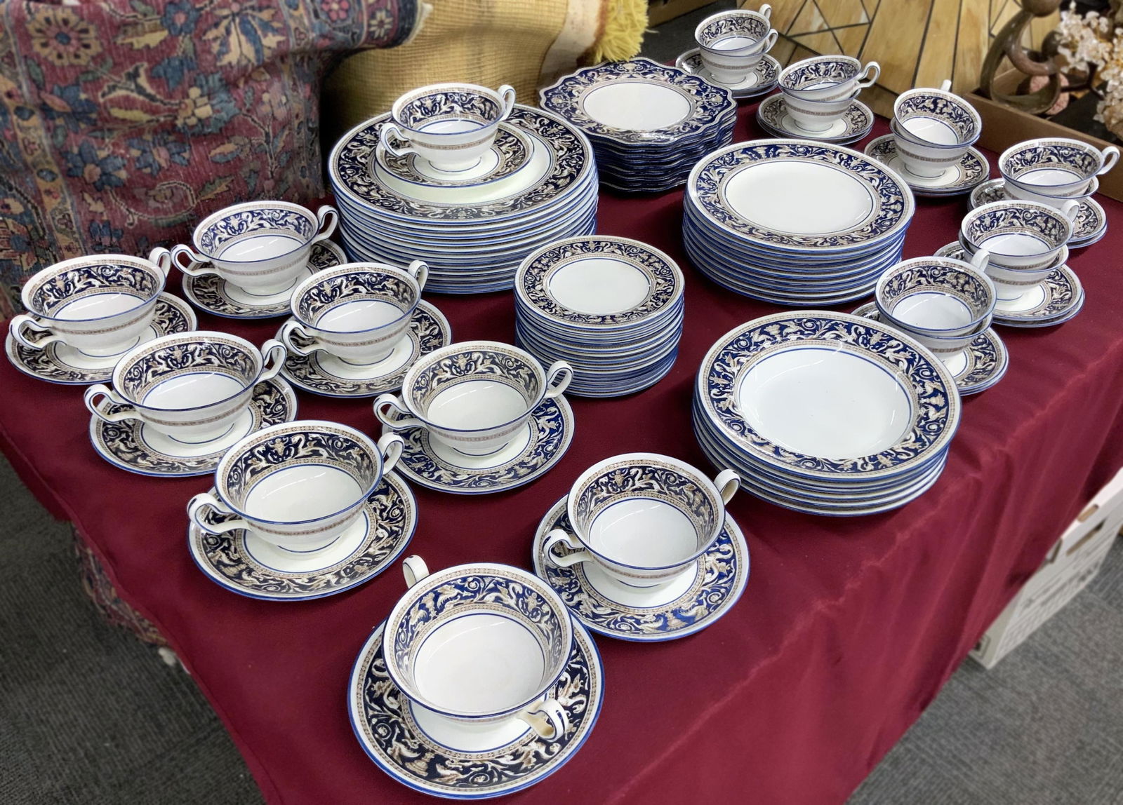 92 Pc. Set of Wedgwood Florentine China.: With dark blue dragon designs. The Set includes dinner plates, salad plates, soup bowls, underplates, cups, saucers, and more. Most appear to be in Nice condition; a few items have small chips. The la