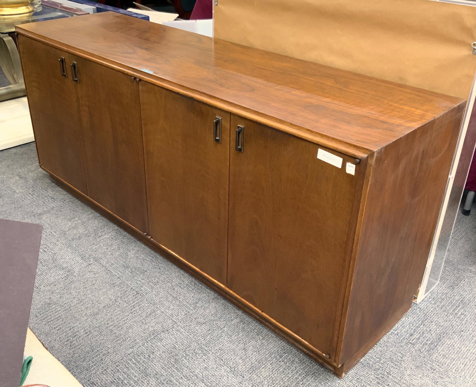 Mid-Century Modern Founders Rosewood Sideboard.: This sideboard has 4 doors and stands on a solid base. One side has a shelf and the other has 4 drawers. The Sideboard is in Good overall condition, with no stains or damage. The finish is in good con