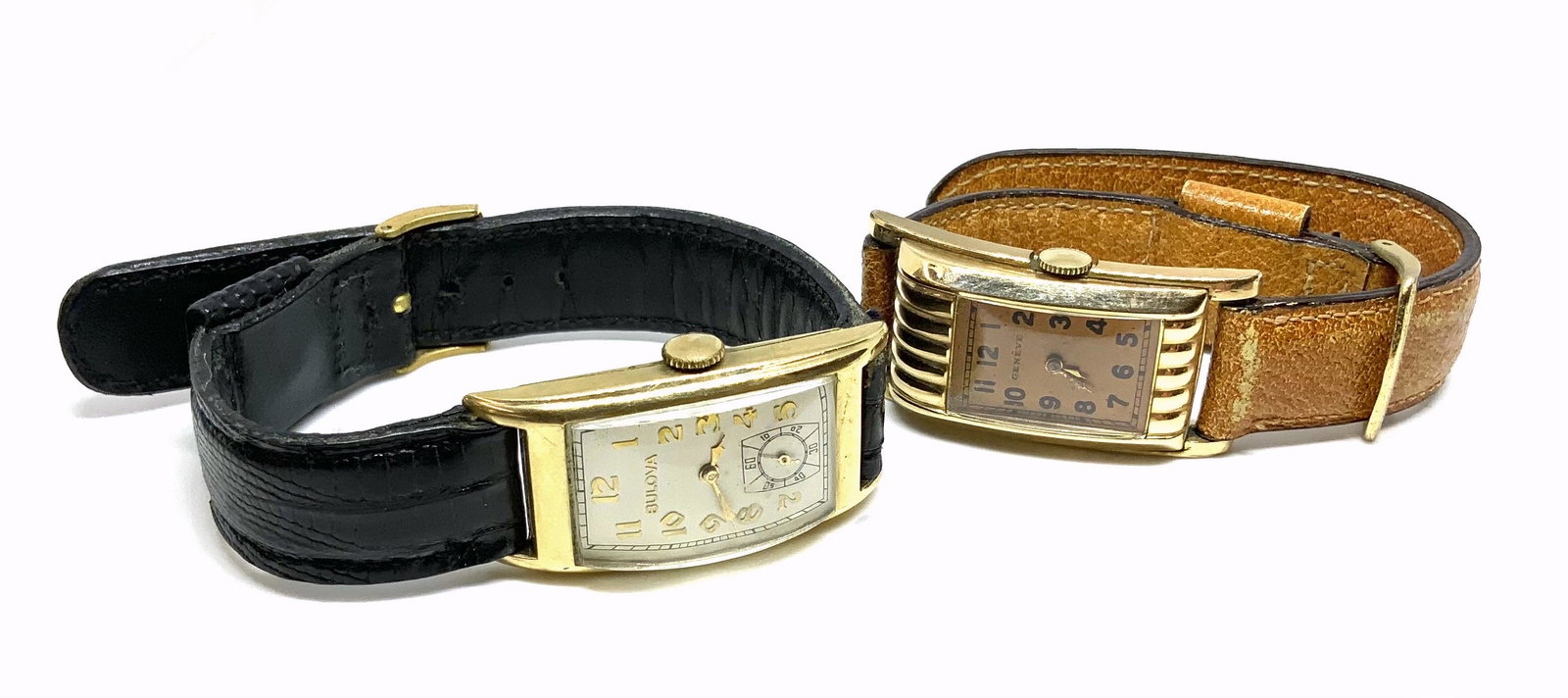 Lot: 2 Art Deco Curved Watches - Bulova & Geneve.: Both Watches are Ticking. The Bulova has an 8K to 10K Gold-Filled Case. The Geneve has a Base Metal Back. They are in Pretty Good Overall Condition for their Age. The Bulova measures 34mm x 20mm.