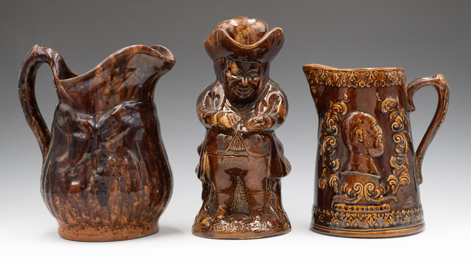 Lot of 3 Bennington-Style Pottery Pitchers. (1 of 2)