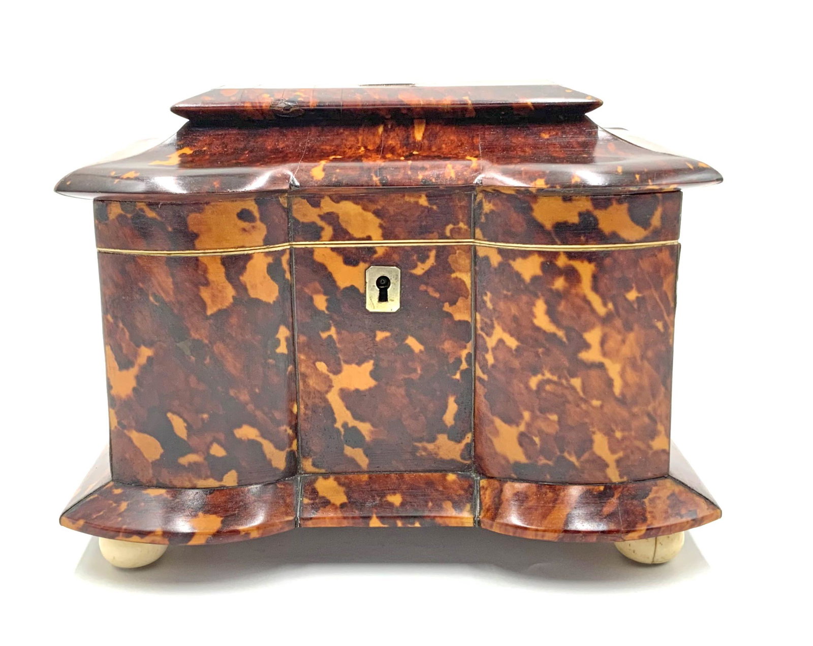 Antique Bone Tea Caddy w/ Tortoise Shell Finish.: Likely Georgian, on little round feet, with two lidded compartments inside. There is also a key included. It Looks to be in overall Good condition, with some Cracks on the Tortoise shell finish. Measu