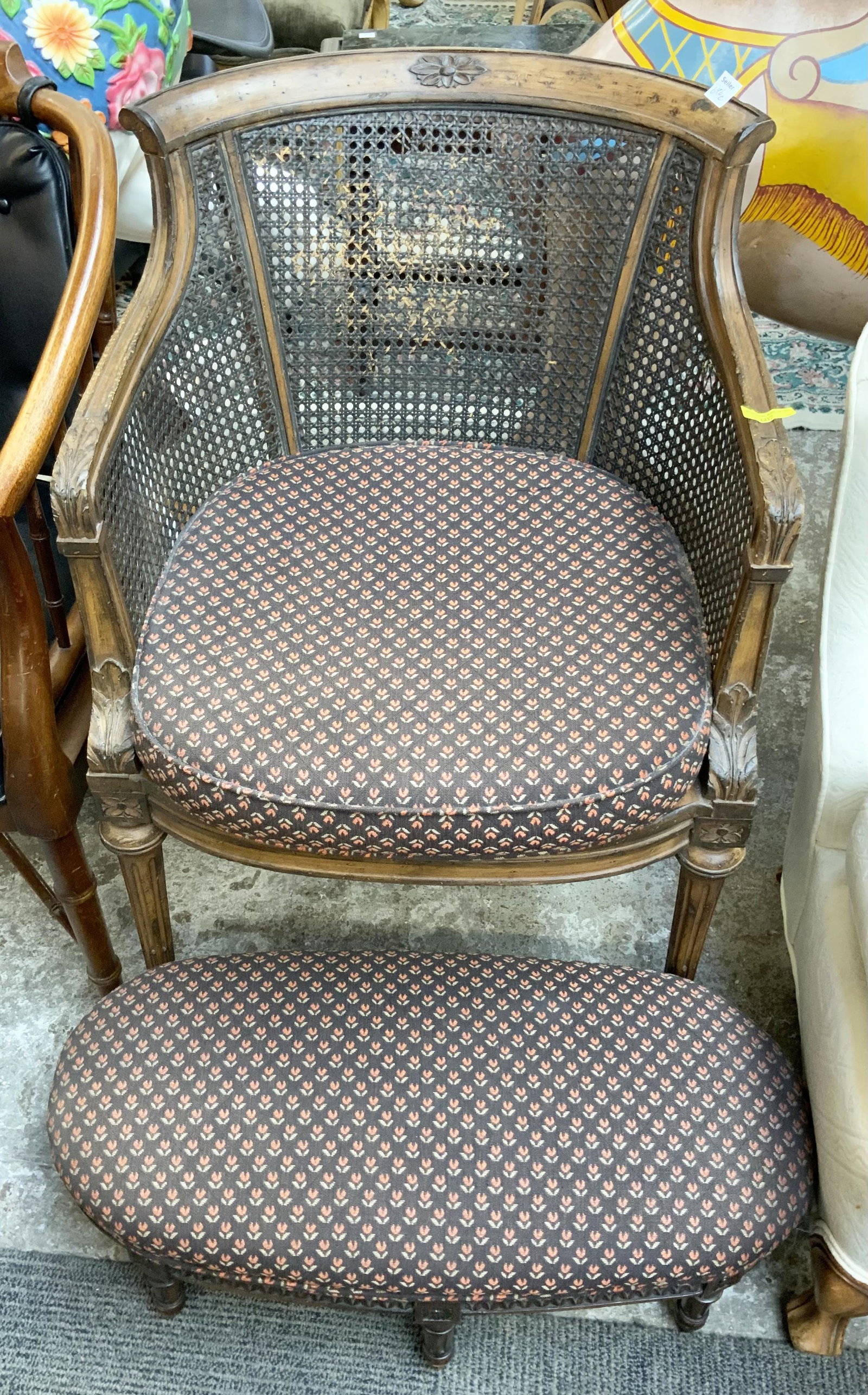 Caned Accent Chair with Foot Stool.: This distressed finish occassional chair is in good overall condition, with no sign of damage. The distressed finish on the back of the chair is starting to show wear, but the cane is intact. The chai
