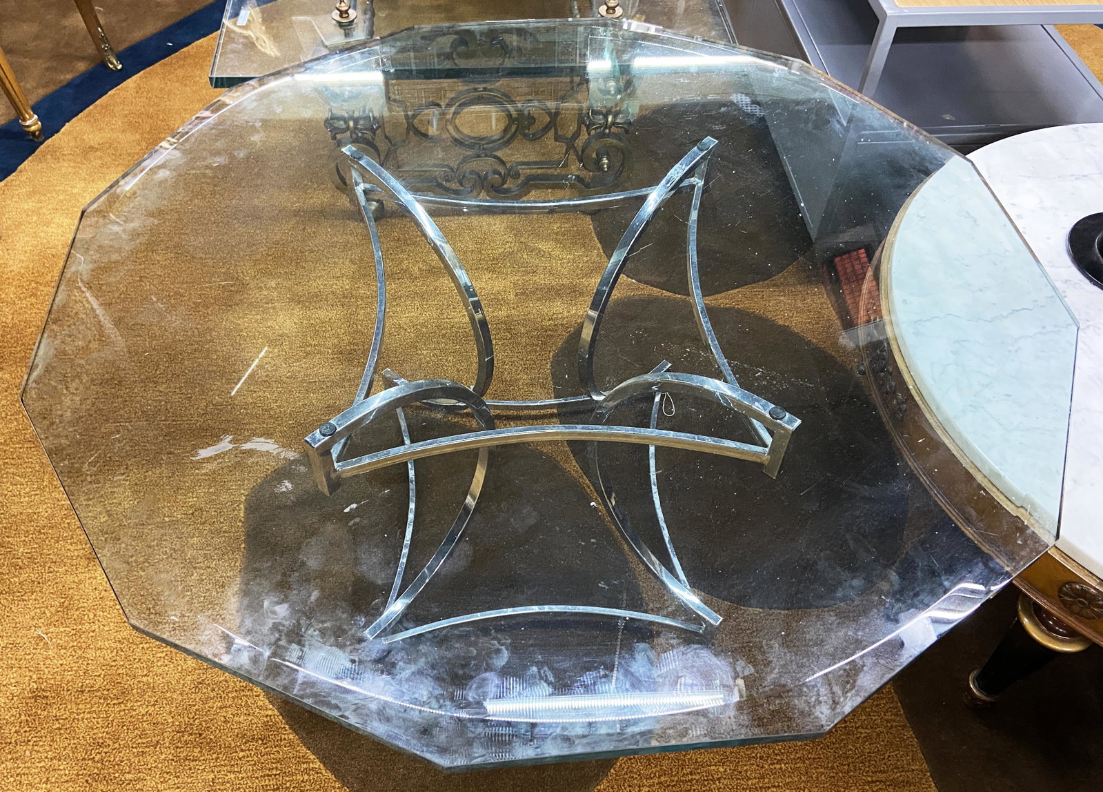11-Sided Glass and Chrome Coffee Table.: This coffee table has a bevelled glass top sitting on a chrome base. It Appears to be intact, and in overall very good condition. It measures 40 1/2" wide and 20" tall. Third Party Freight Shipping or
