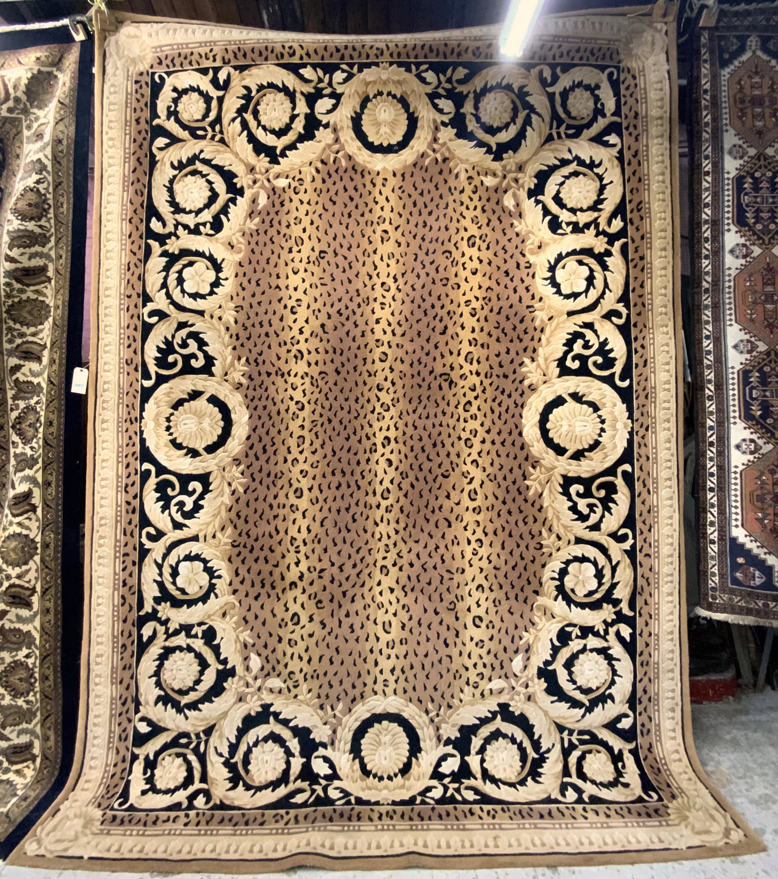 13' 2" X 9' 5" Leopard-Style Sculptured Rug.: This rug has a brown and gold field with a black border and leopard-like spots. It appears to be in good overall condition. There are no signs of damage or stains. Third Party Freight Shipping or Pers