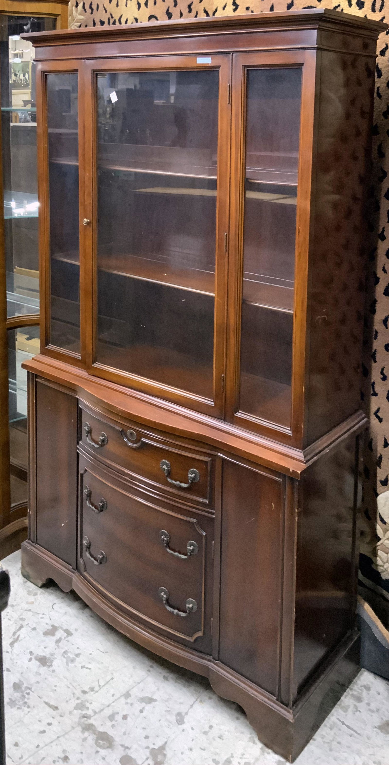 Single-Door Mahogany Bow-Front China Cabinet.: This China Cabinet is in Good overall condition, with no signs of damage. It measures 41" Wide, 14" deep, 71" tall. Third-party freight shipping or personal pickup required.