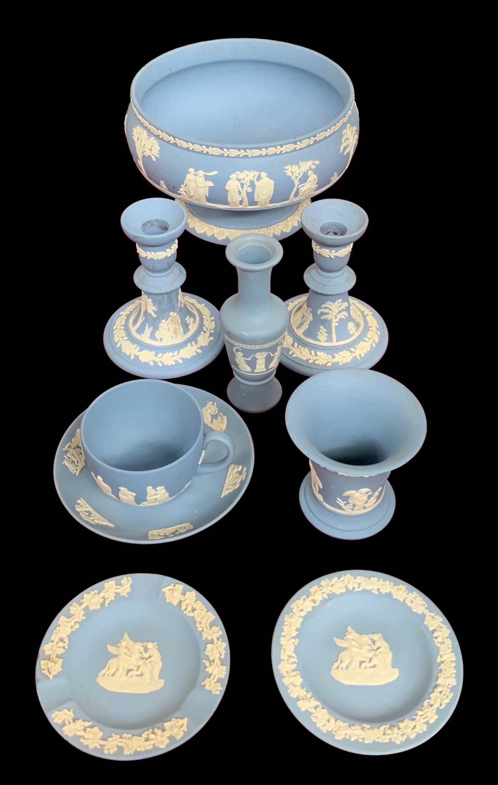 8 pc. Lot of Mostly Wedgwood Jasperware.: This lot contains two candleholders, a centerpiece bowl, a tea cup and saucer, two small plates, a small glass, and a small vase. The small vase is the only piece that is not marked Wedgwood, and the