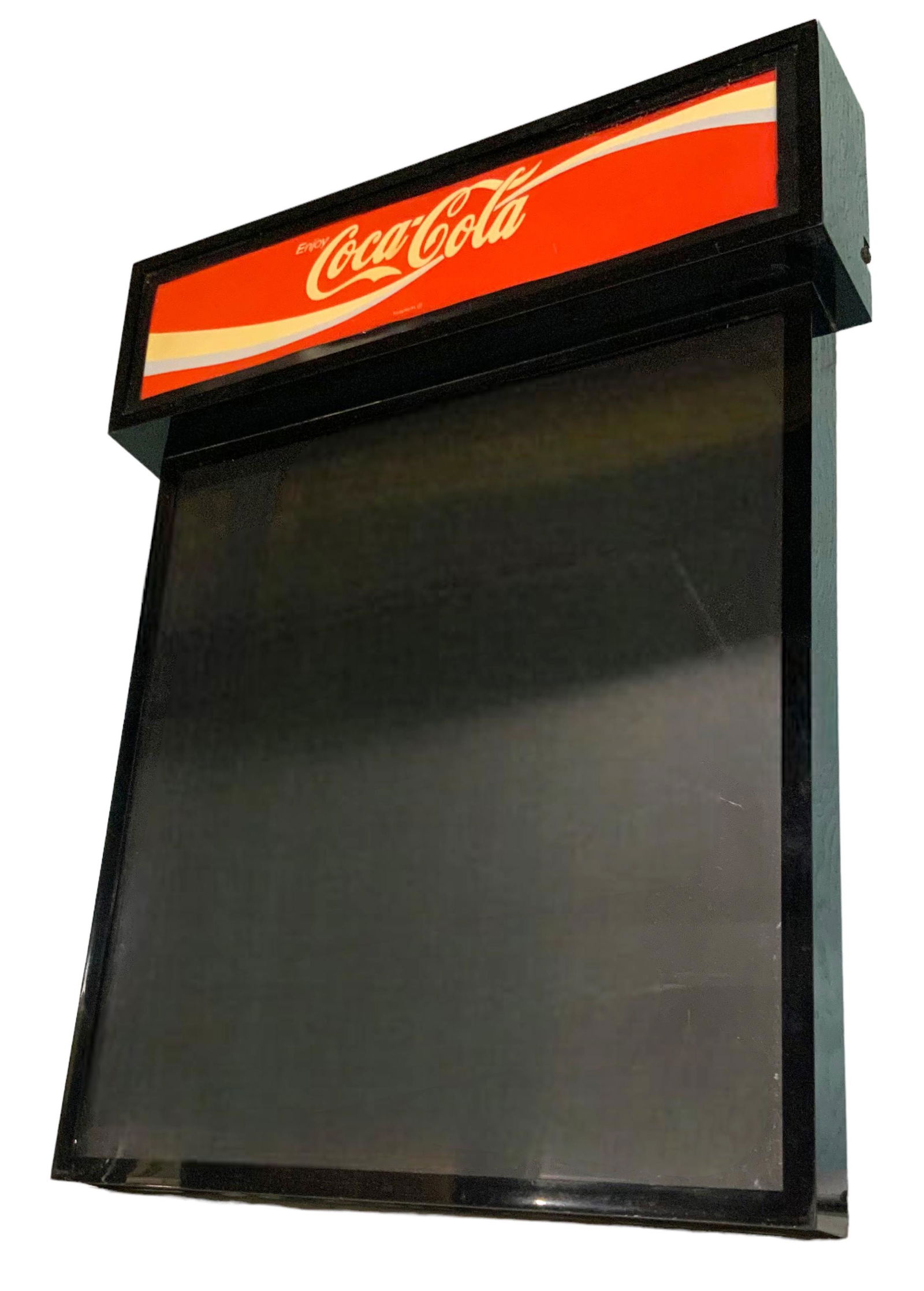 Coca-Cola Illuminated Menu Board.: A Hanging Coke brand illuminated menu board with the Coca Cola banner at the top. The piece is Untested, but appears to be in good condition. The Board measures 24" x 17 1/2". Third-party shipping or