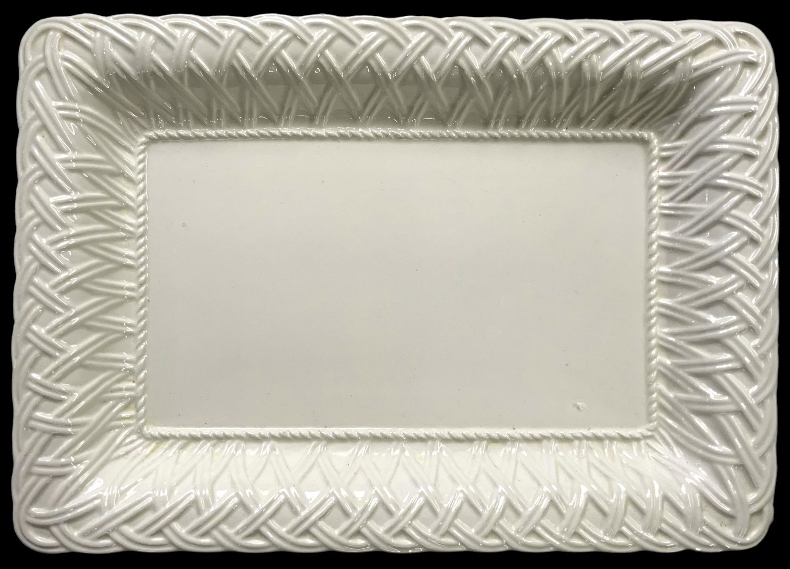 Tiffany White Ceramic Platter, Made In Italy.: It is Signed on the Underside. There is a basket weave design along the border. The corners have Scratches on the Undersides, as well as a Small Chip in the glaze. Measurements of the platter are 18 1