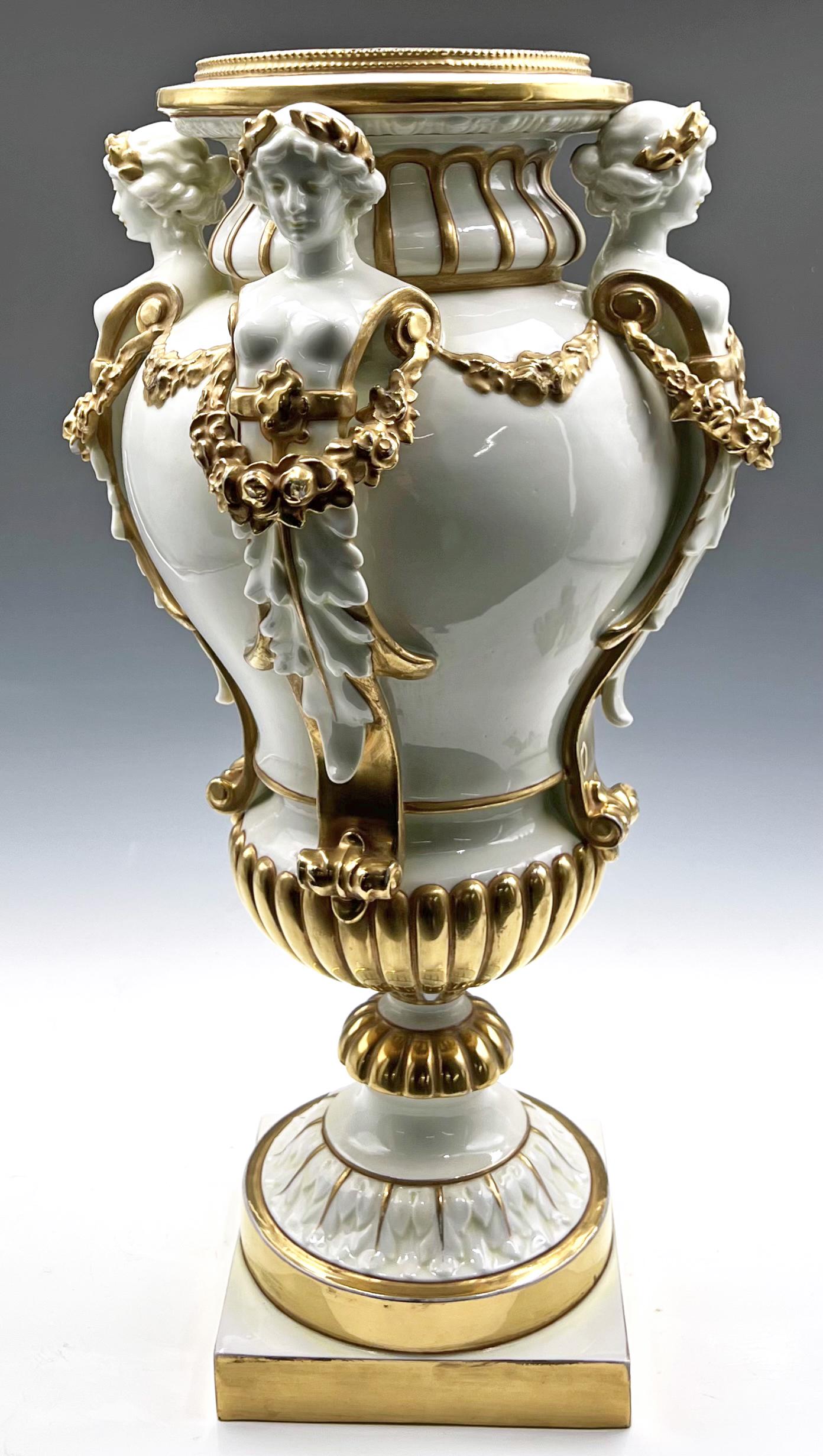 17" Volkstedt-Rudolstadt Urn w/ Nudes.: It is Signed on the Underside. The Urn is Decorated with four nude ladies bearing golden crowns and garlands. There is some Gilt Loss and a few small Chips (The Most Noticeable on the Knob just above 