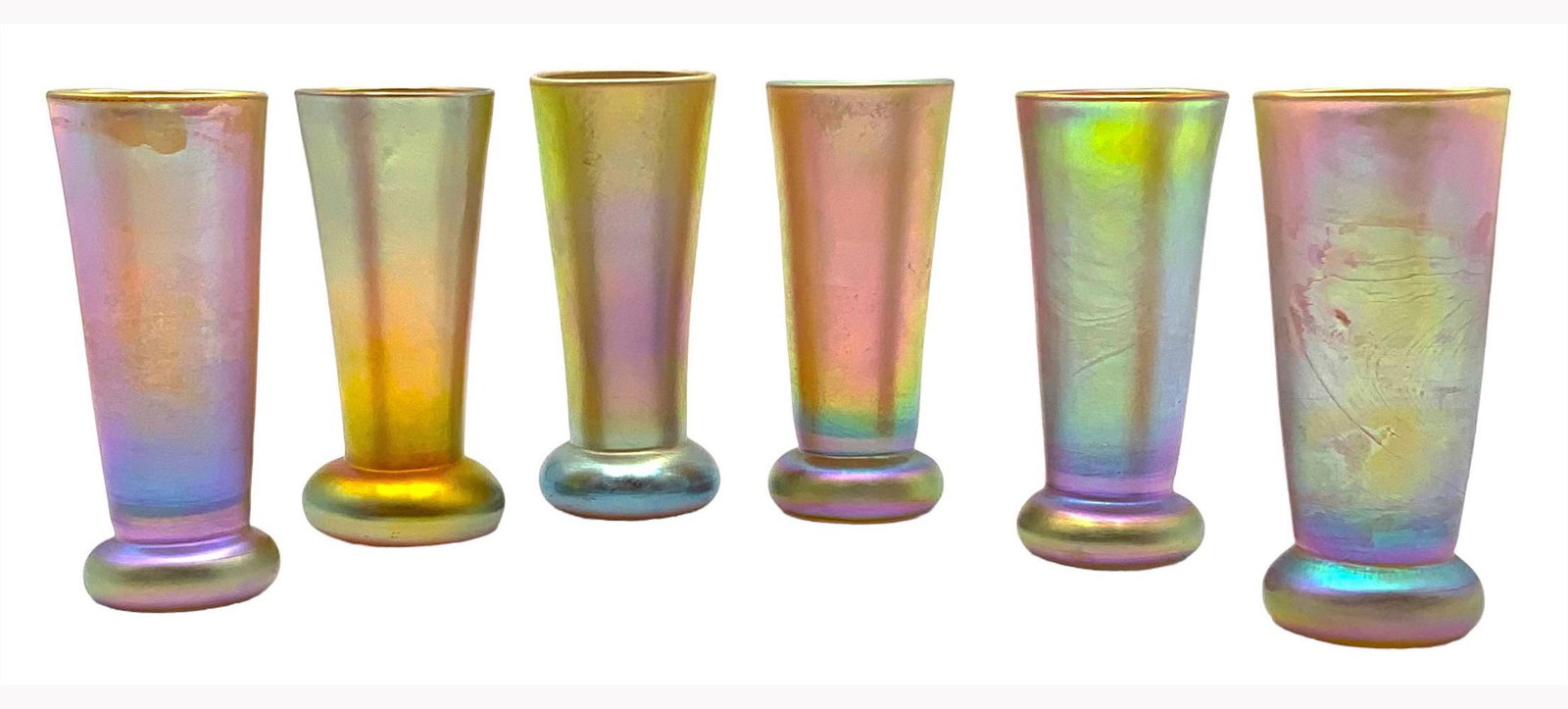 Set of 6 Tiffany Favrile Art Glass Tumblers.: They are Signed, "L.C.T." on the Undersides. They look to be in Nice condition. Each measures 4 3/4" tall and 2" in diameter across the rim. In-House Shipping is Available. Please Contact us Post-Auct