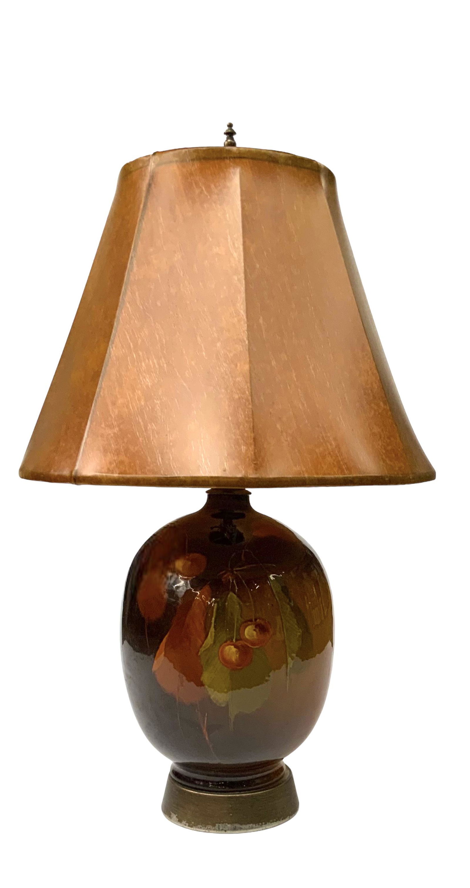 Painted Pottery Lamp w/ Cherries and Leaves.: This high-glaze pottery lamp appears to be Unsigned. It Looks to be in Nice cosmetic condition. It Measures 28" tall, and the shade measures 16 1/2" in diameter. Third-Party Shipping or Personal Picku