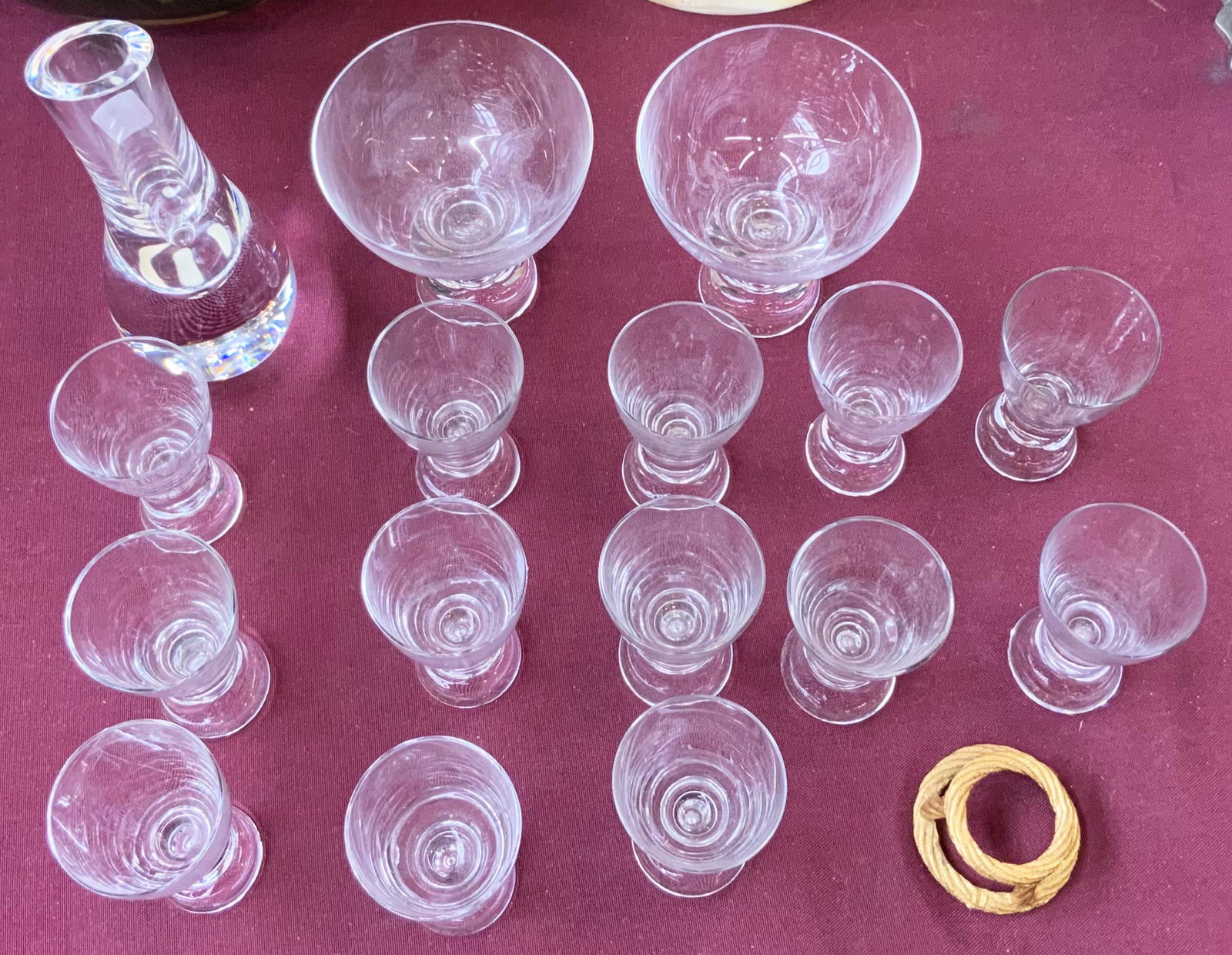 Lot: Baccarat Bud Base and Iitala Tapio Glassware.: The Lot includes a bud vase,13 small glasses that are for shots or aperitifs and 2 larger cocktail glasses. Everything except the Bud Vase is Iitala Tapio Mid-Century Glass. There is a small gold tone