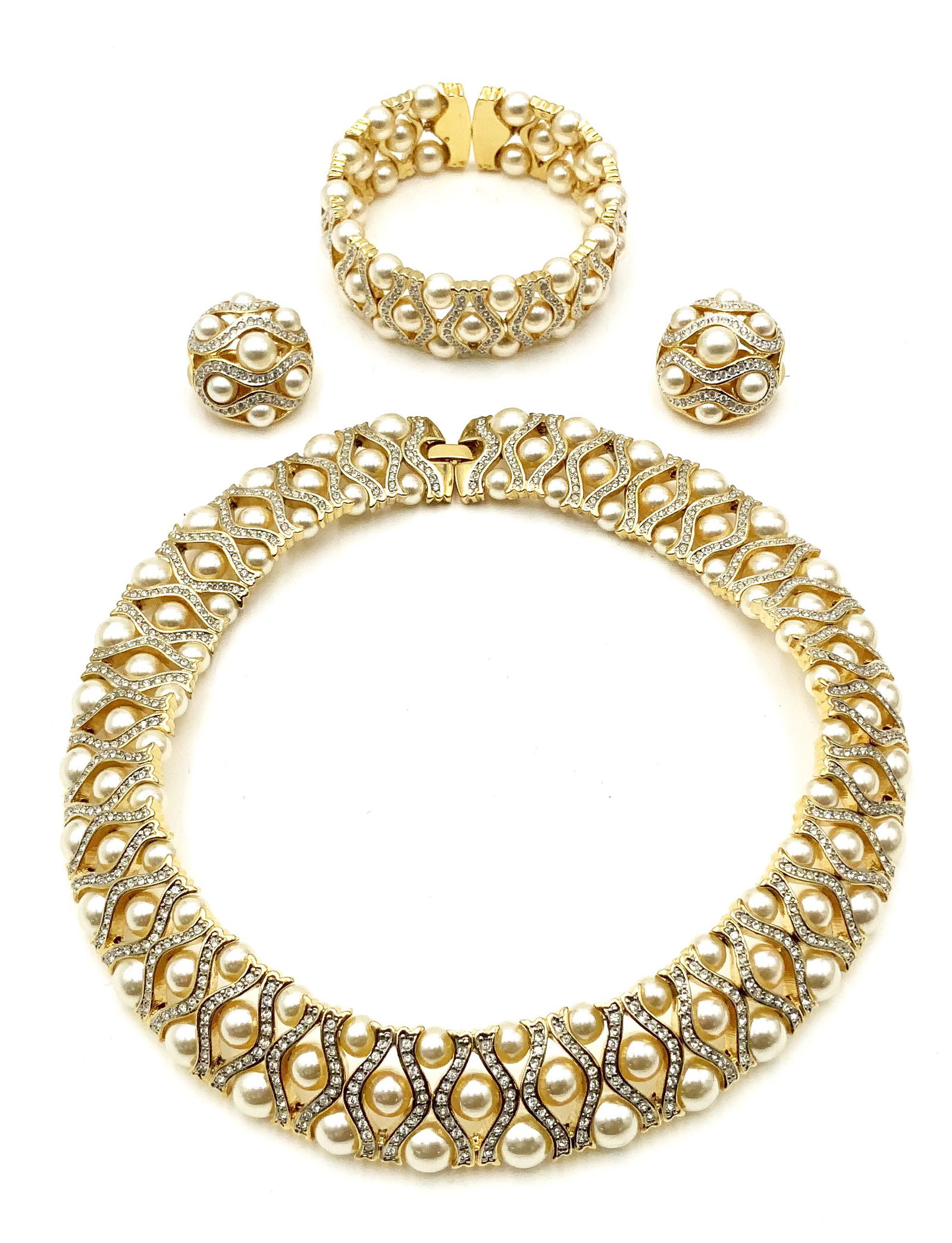 Faux Pearl Costume Jewelry Set.: The Set Consists of a Choker, a Bracelet, and a Pair of Earrings. The Set is not Signed. The Earrings are Clip-On Type. The Interior Dimensions of the Bracelet measures 2" Across, but it Stretches. Th