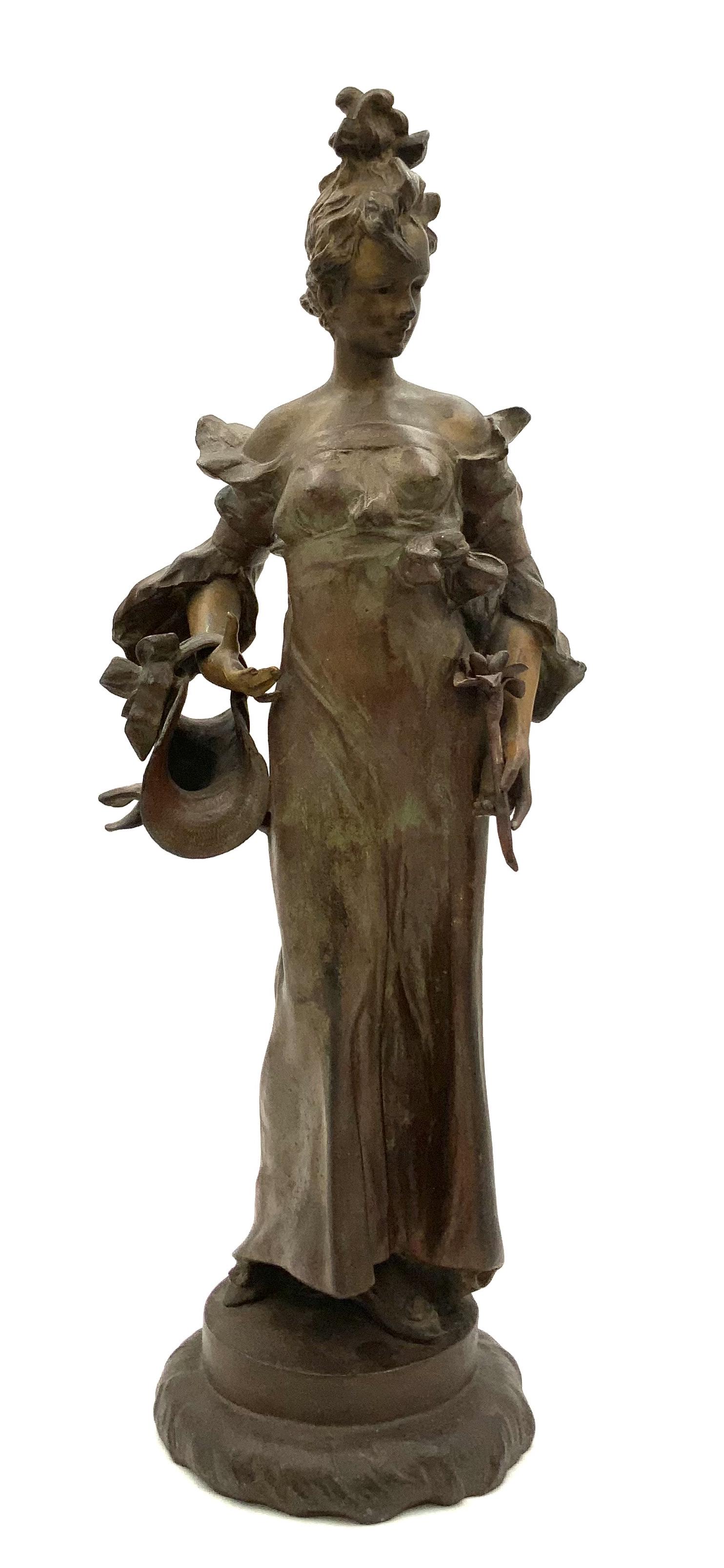 Sgd. Ant Nelson Art Nouveau Bronze? Figure.: This sculpture is of a woman astride holding a flower and a hat in her arms. It is signed "Ant Nelson" on its base. It is not magnetic. There appears to be green and red lacquer residue. The statue is