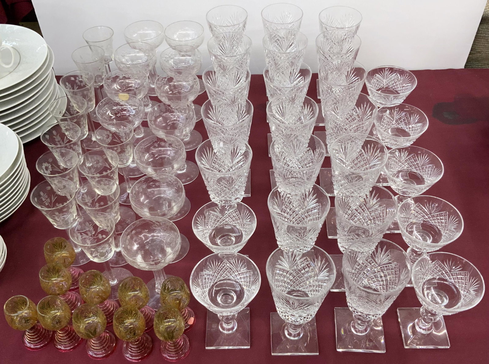 58 Pc. Lot of Assorted Stemware - Hawkes, etc.: The lot Includes signed Hawkes crystal wine goblets and sherbet glasses, Unsigned etched glass goblets and sherbets, and hand-painted Gold cordial glasses with pink stems. The Lot looks to be in Good 