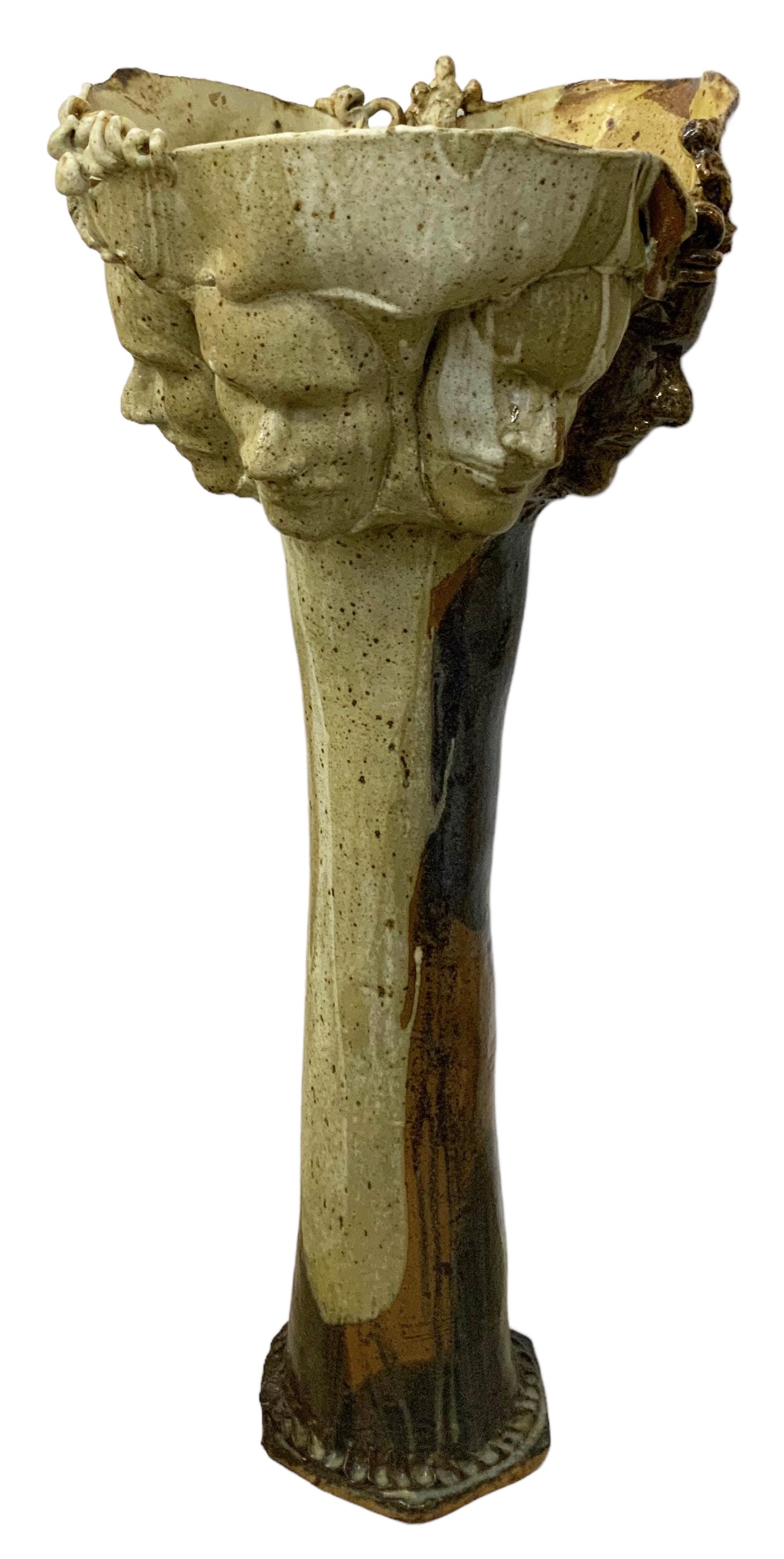 40" Pedestal Pottery Sculpture w/ Human Faces. (1 of 3)