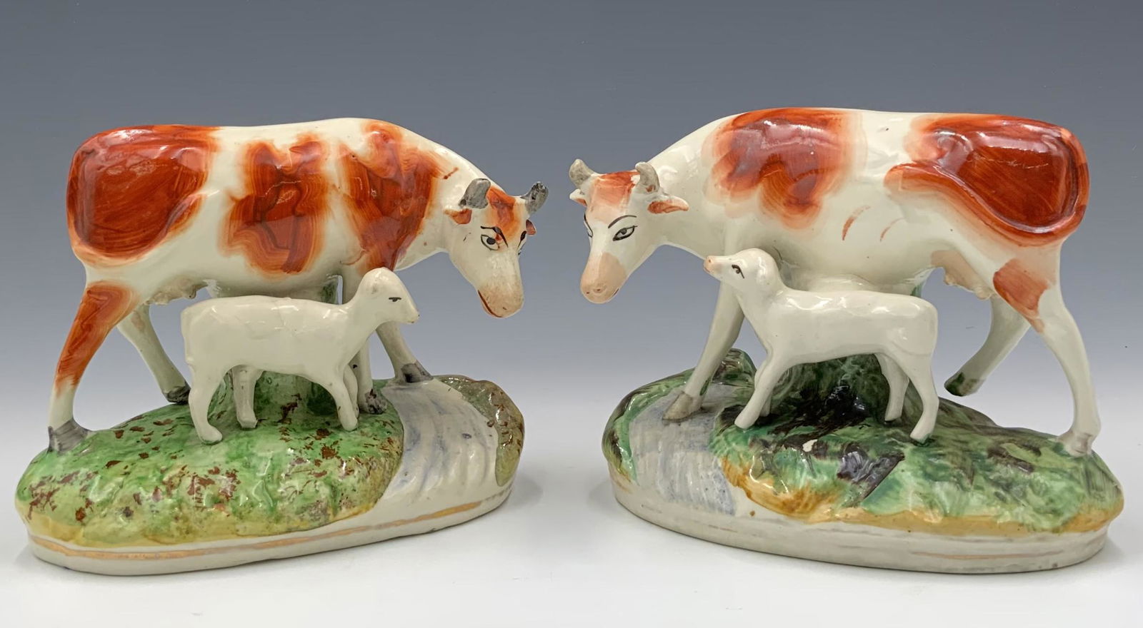 Pair of Staffordshire Cow Figurines. (1 of 3)
