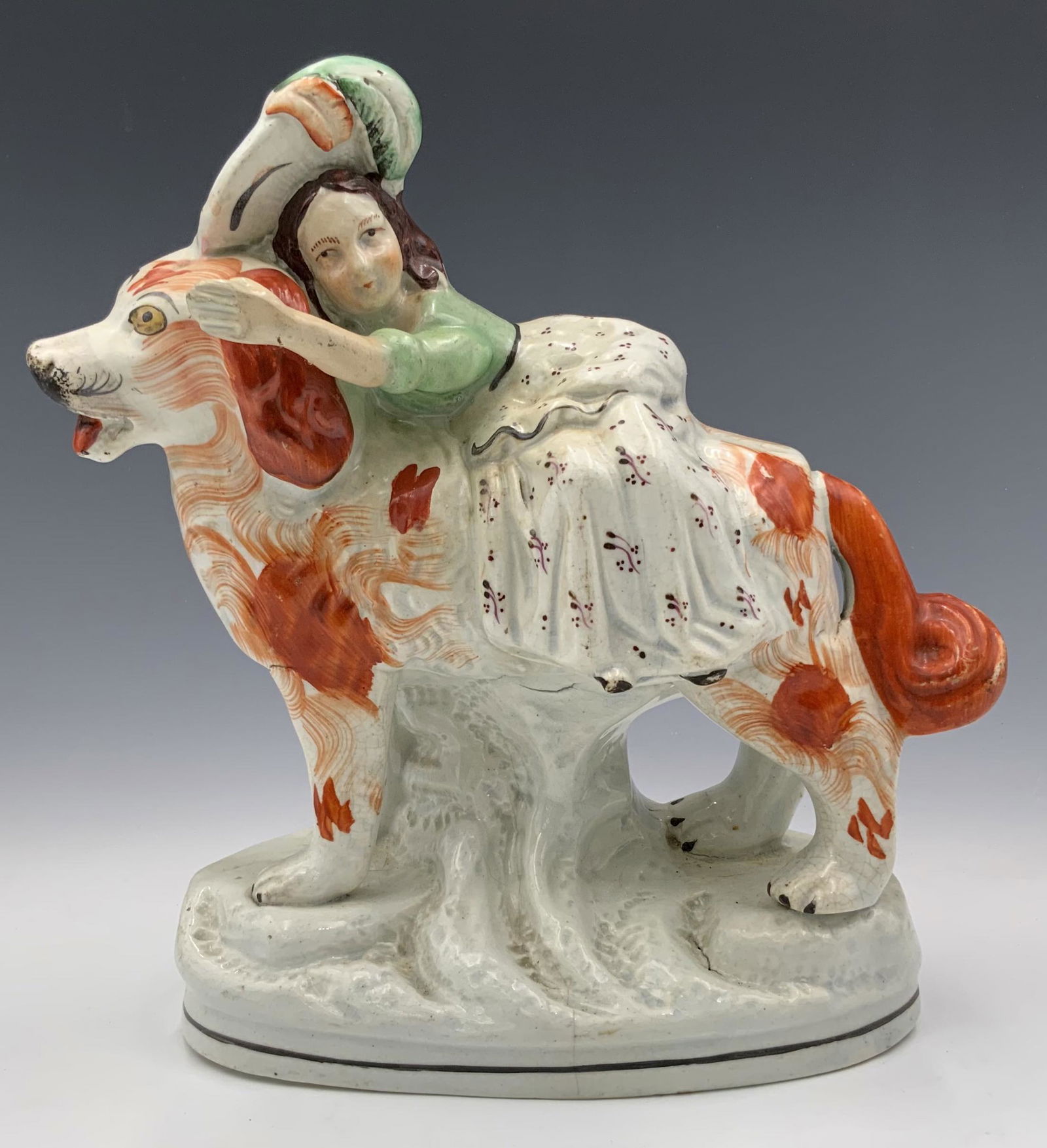 Staffordshire Figurine of Woman Riding Large Dog. (1 of 3)