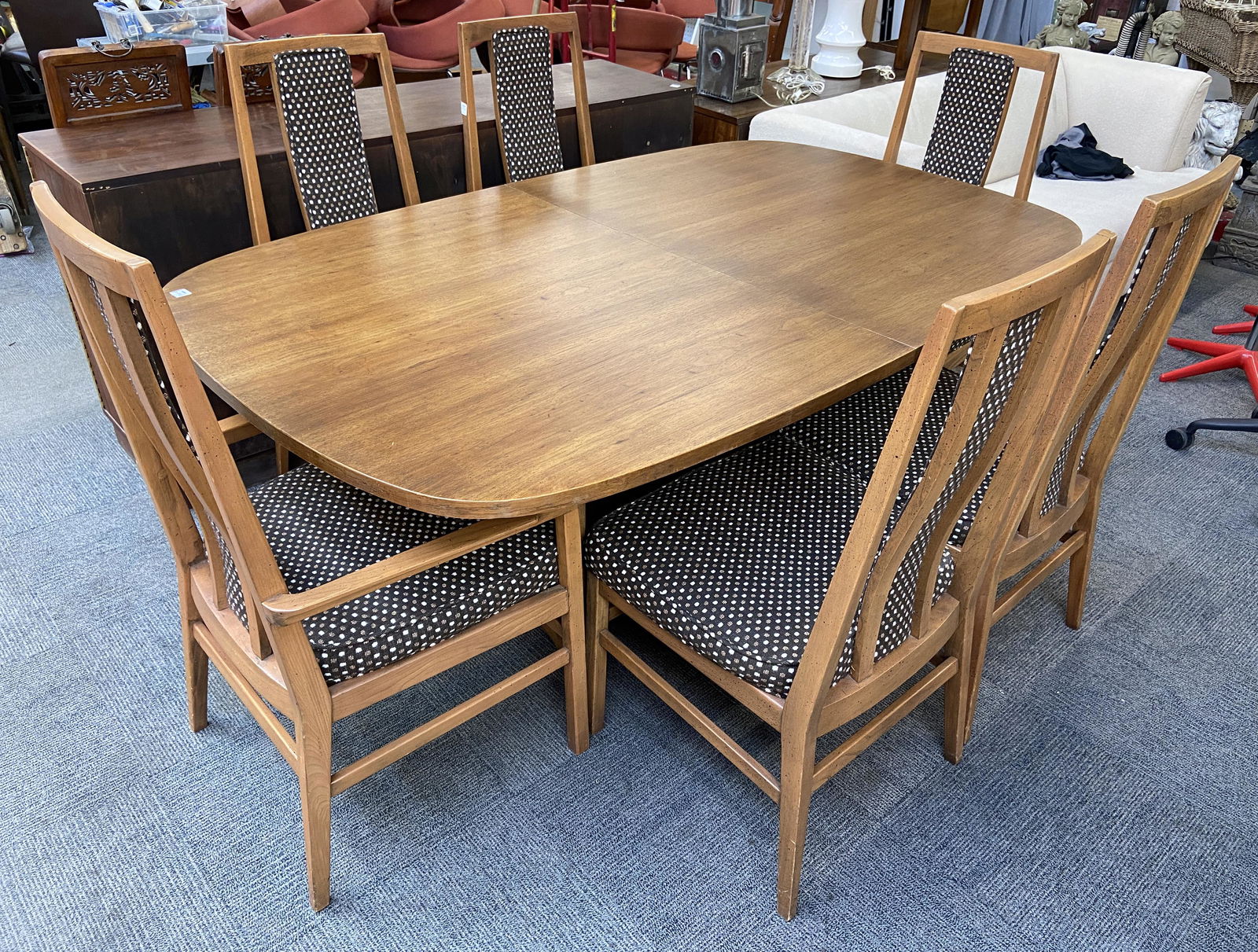 Mid-Century Modern Dining Room Set.: The Set Consists of a Medium Color Wood Dining Table, 2 Leaves, and 6 Chairs. The Designer / Manufacturer is Unknown. The set looks to be in Good Overall Condition. The Table measures 72" Long by 45"