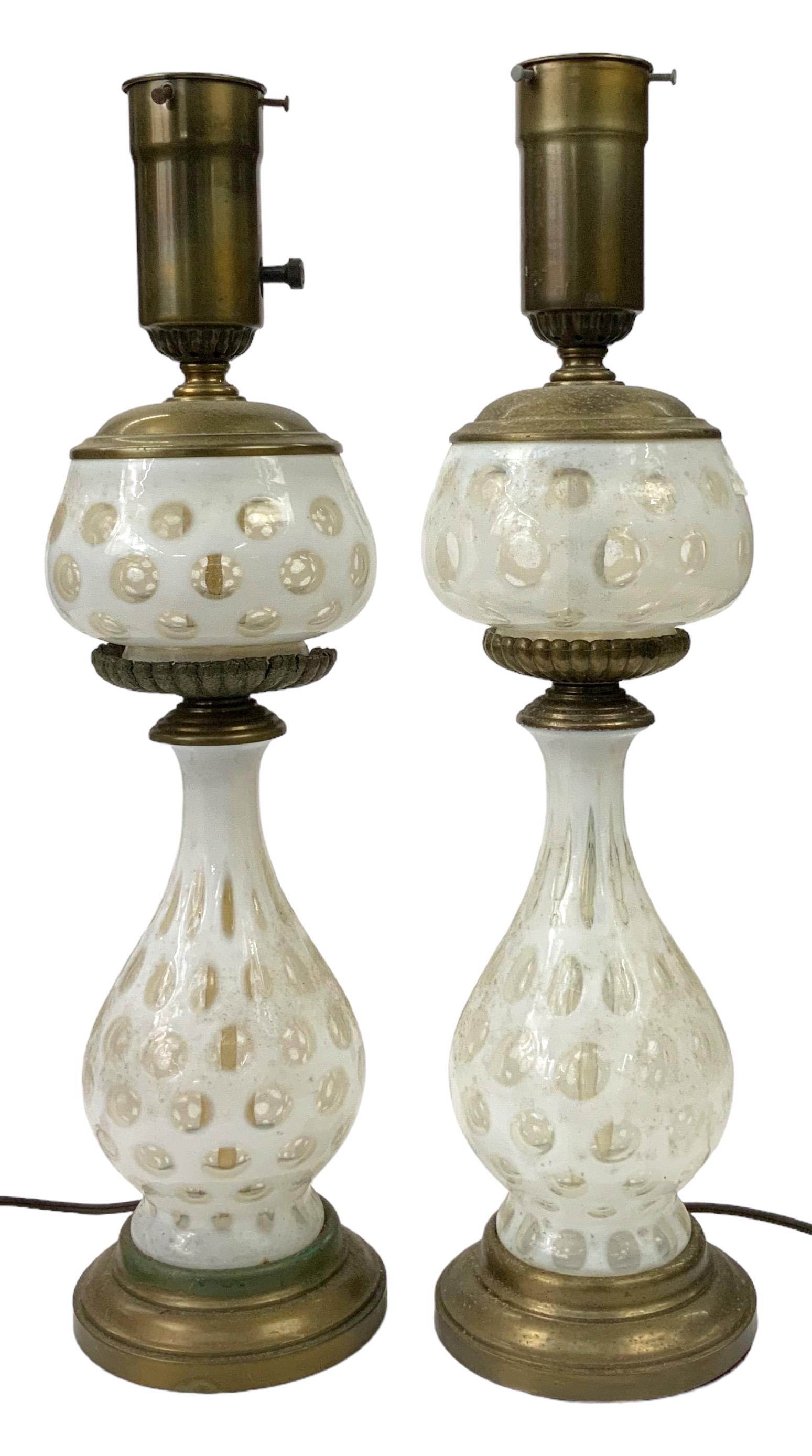 Pair of White Coinspot Glass Lamps.: The Lamps are in good condition, but they are a bit dirty. They do not have shades. The lamps measure 23 1/4" Tall. Third-party shipping or personal pickup is required. Please see our website for our 