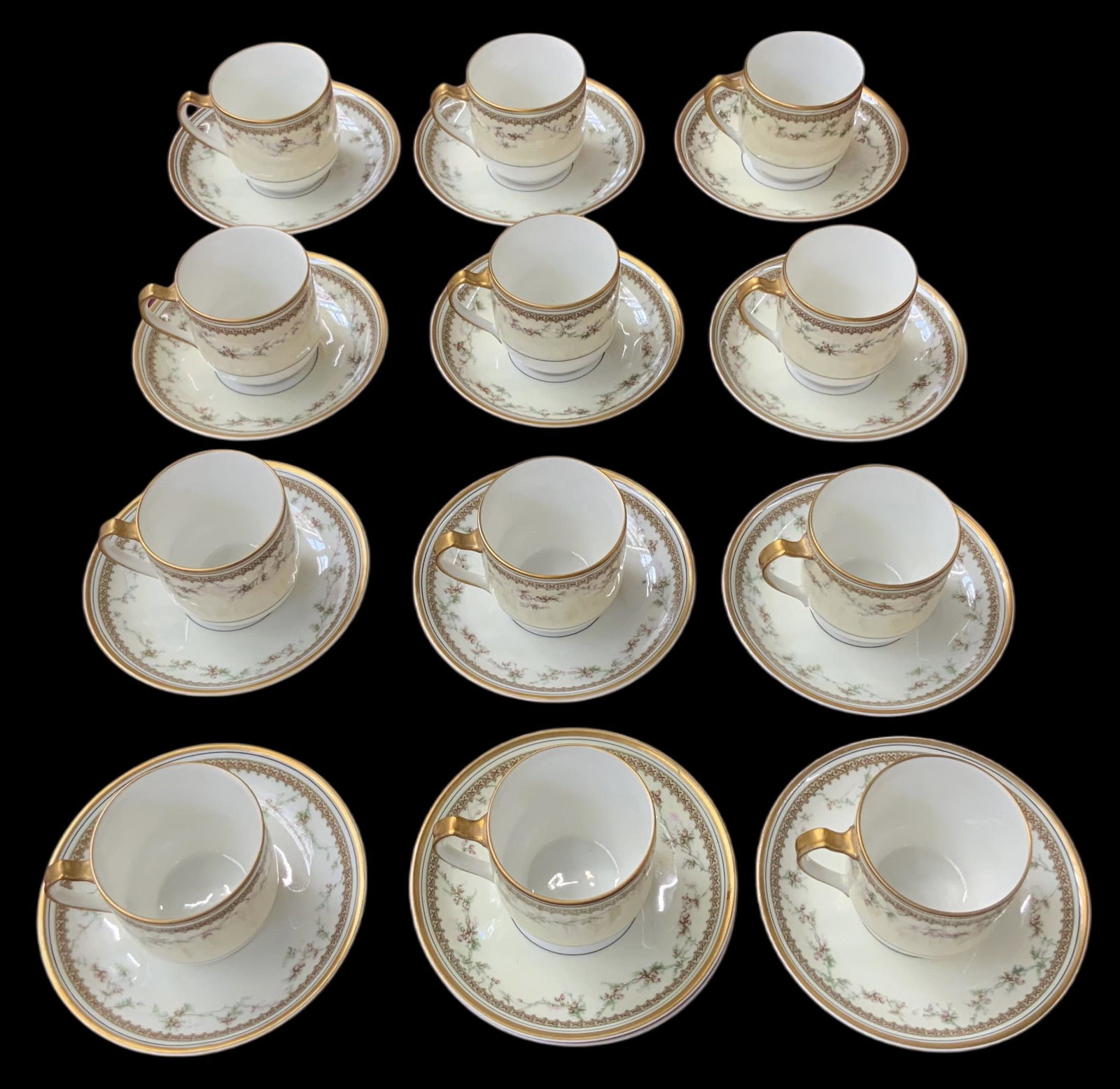 Haviland & Co Limoges Floral Demitasse Set.: The set Includes 12 cups and 13 saucers. They are gold rimmed; the cup handles are also Gilded. The Lot looks to be in overall Good condition, with some minor Paint Loss. The Saucers measure 4 1/2" in