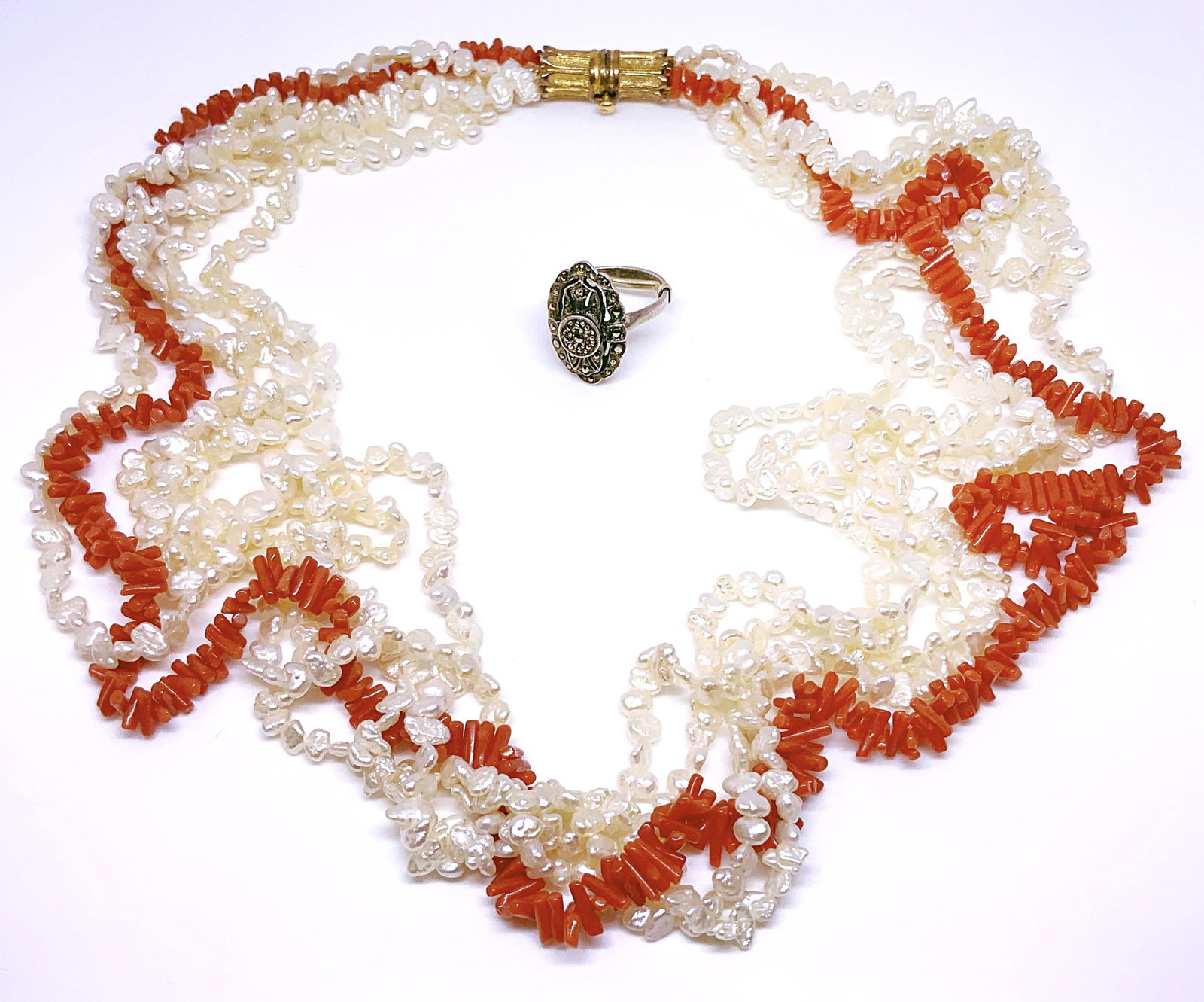 Lot: Coral & Freshwater Pearl Necklace & Ring.: The Ring is a Silver Art Deco Marcasite Ring. The Ring measures 3/4" Long. It has a ring spacer on it, which makes it fit a smaller finger than normal. With the spacer on it, the ring is a size 3 1/4.
