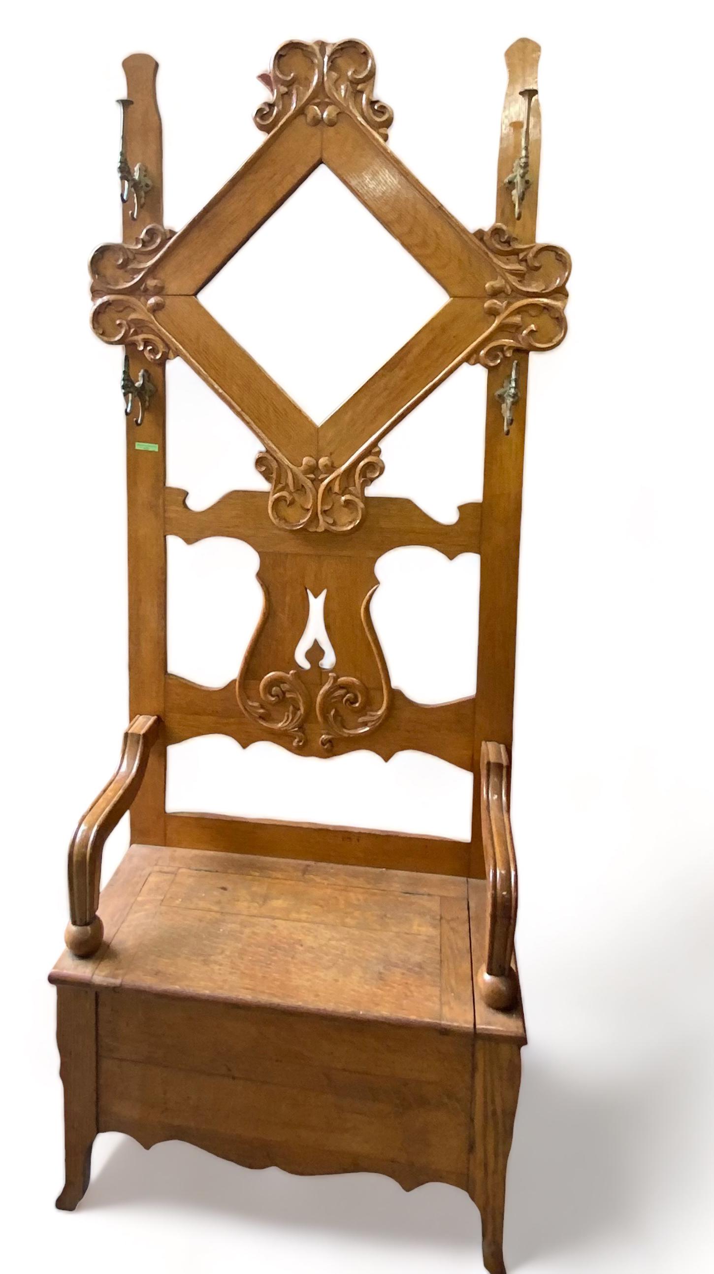 Antique Golden Oak Hall Tree w/ Boot Box.: The Hall Tree is intact and solid. The Finish is in need of touch up. There are No signs of damage. The Mirror needs re-silvering. One metal coat hook is damaged, but overall the piece is in good cond