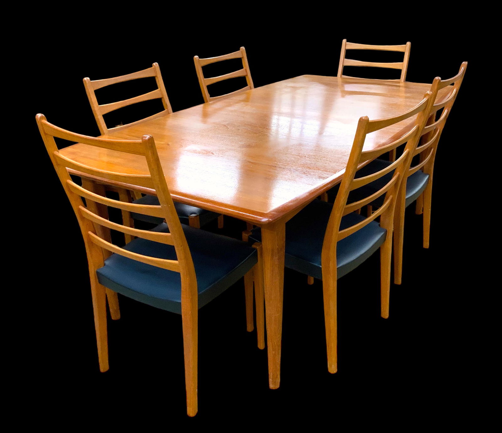 Svegards Markaryd Teak Dining Table & Chairs Set.: This Set is Swedish Made. The Table is not Signed, but the Chairs all have an impressed mark. The Table has the leaves Tucked underneath it. There are 6 Chairs altogether. The Set is in Very Good Over