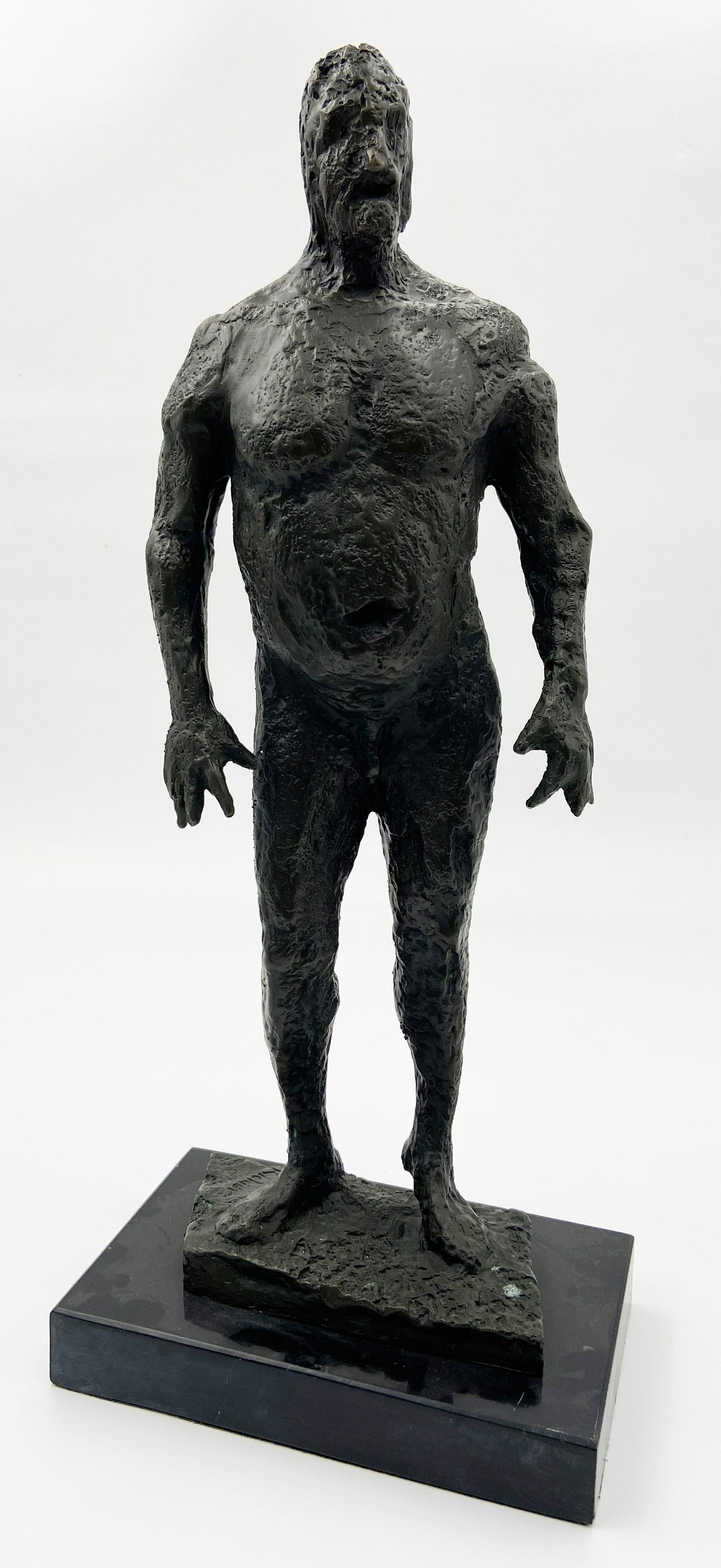 Sgd. Bronze After "Storm Man" by Germaine Richier.: This avant garde bronze sculpture is after Germaine Richier's "Storm Man" statue of a dissolving man. It is mounted to a black stone base. The sculpture has minor areas of oxidation. It measures 17" t