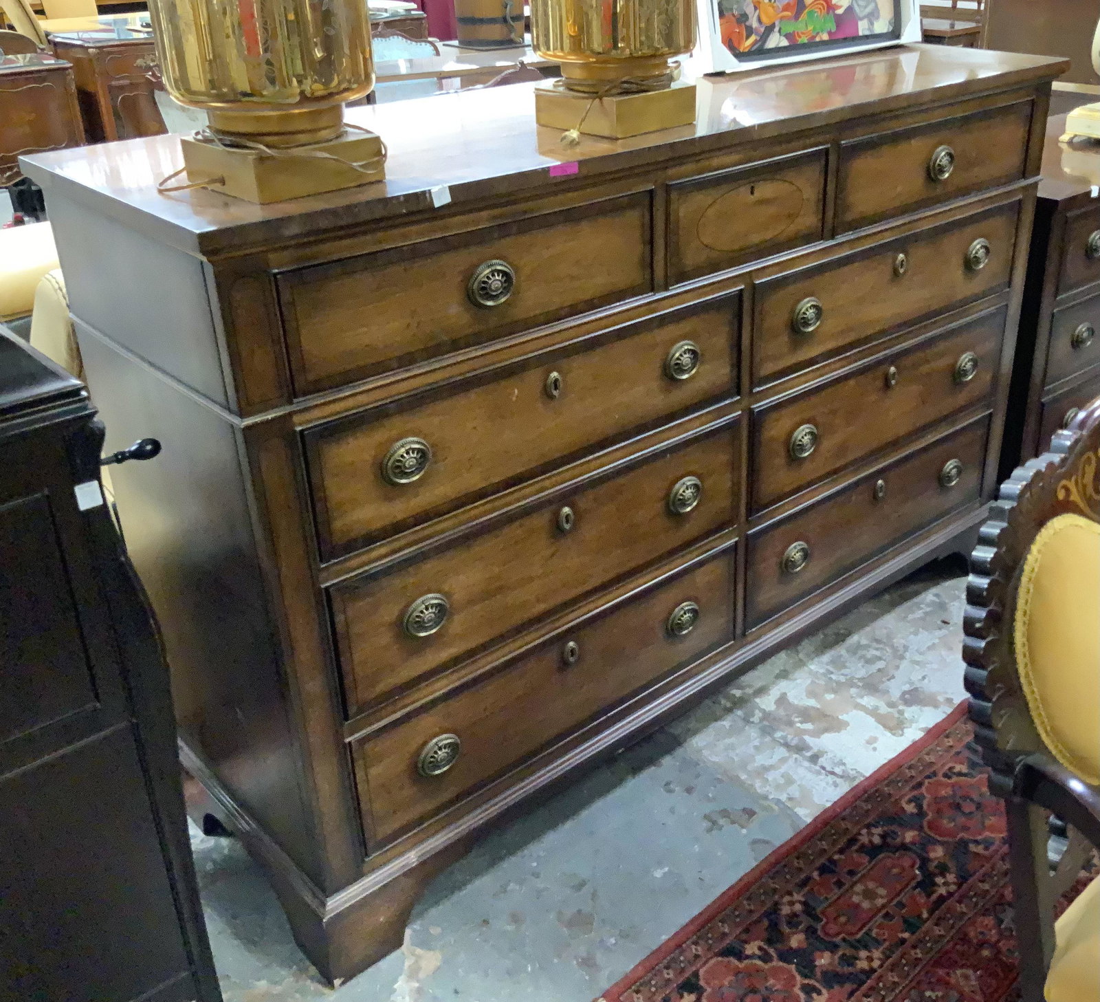 Henredon Mahogany 9-Drawer Dresser.: This Banded Mahogany dresser has some minor signs of use, but is in good overall condition. There is an older Henredon sales brochure and locking key included. It Measures 66 1/2" wide, 21" deep, and