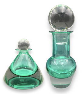 Lot of 2 Unsigned Glass Decanters.: This lot containts two large teal-colored decanters in the style of Mario Pinzoni's designs for Seguso Vetri d'Arte. They are both unsigned. The oddly shaped pair both have glass stoppers. They both h