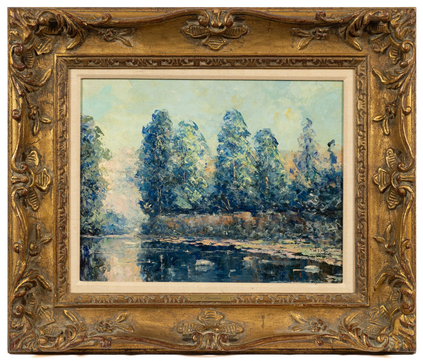 Impressionist Oil Painting on Board.: The frame bears a plaque that reads "N. Zbanduto", likely for Nina Zbanduto (1894-1988). The painting is unsigned. The work depicts a line of tall trees with a body of water in the foreground. It is h