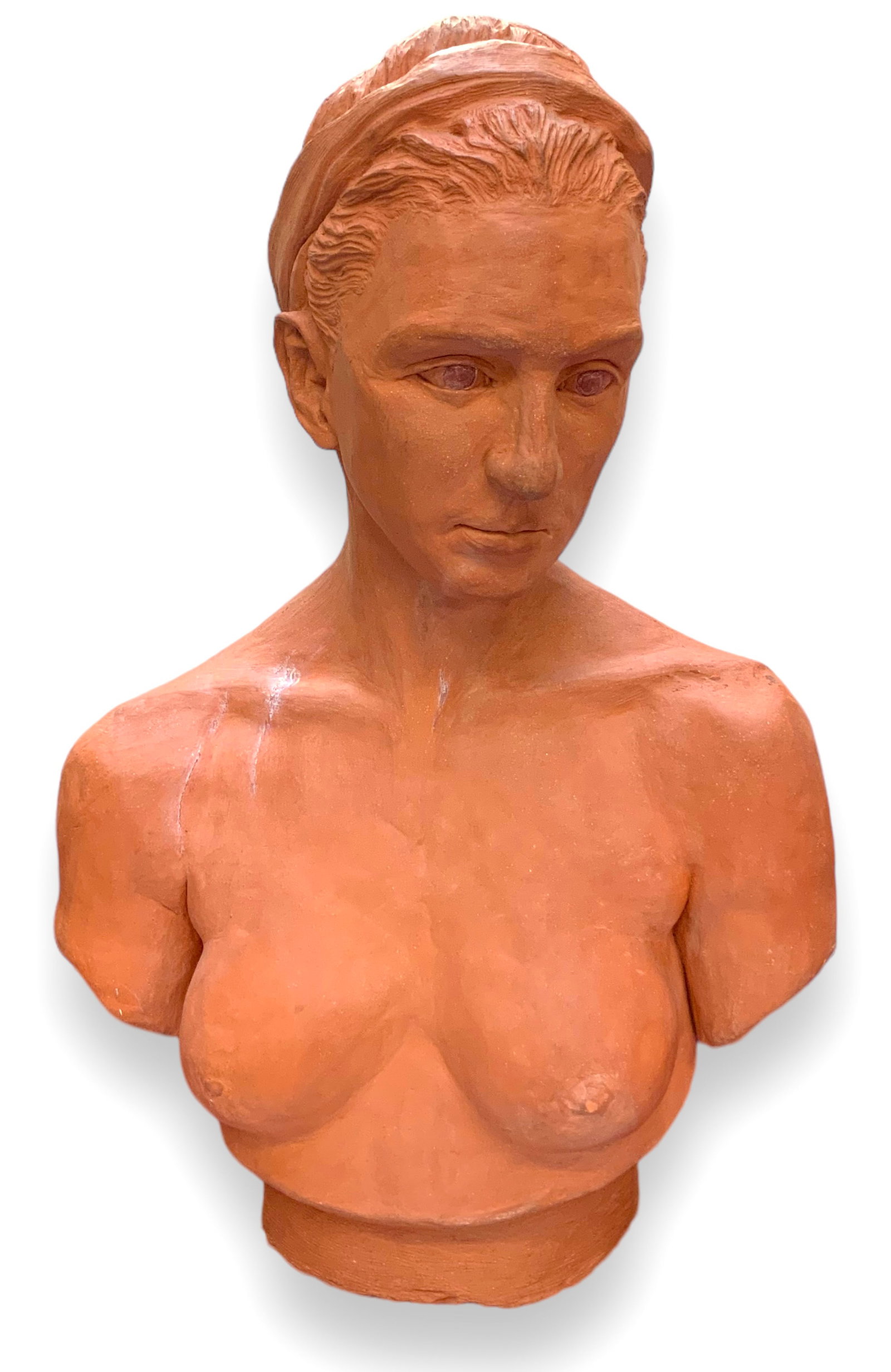 Terra Cotta Bust of a Nude Woman, Signed.: It is Signed on the back, "Joseph Blahut", and dated 1988. The name of the piece is, "Gina". The bust has some Scrape marks on her neck, right clavicle, and right shoulder. There is a Chip on her left