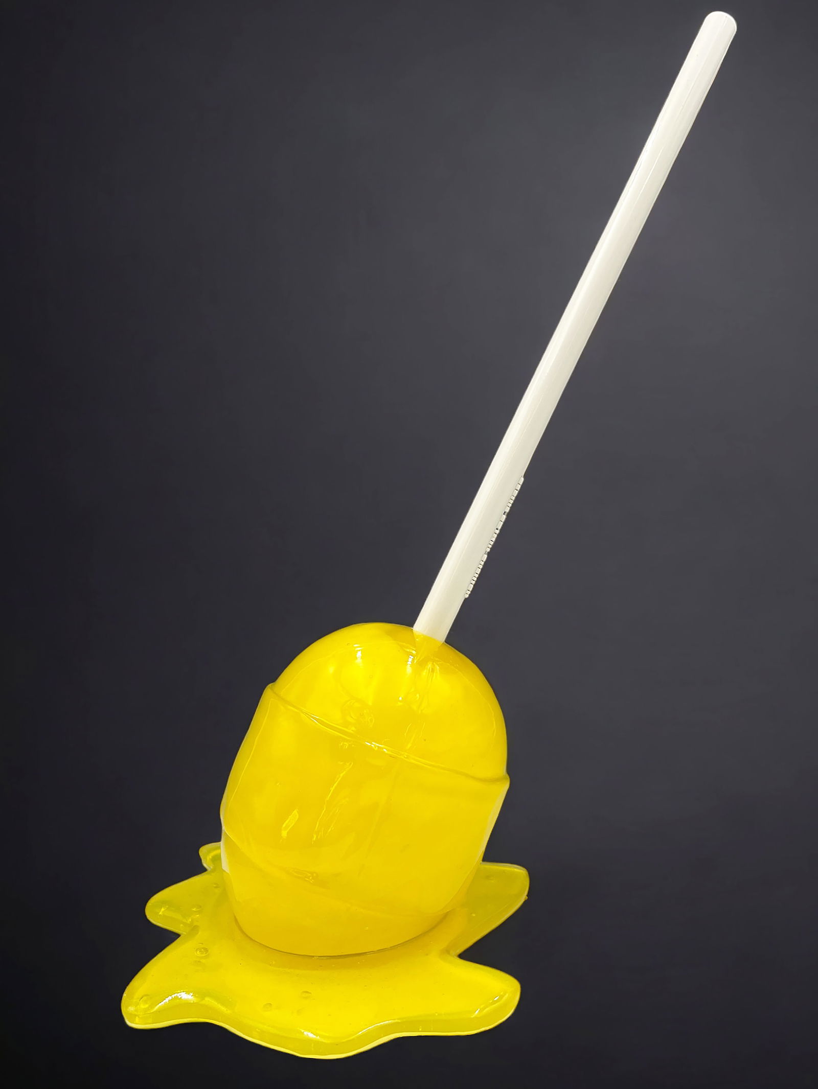 Lemon Meltdown Sculpture, Desire Obtain Cherish.: This cast resin lollipop is signed and numbered on its underside. The work is by Jonathan Paul, aka Desire Obtain Cherish, or DOC. The sculpture bears his sticker of authenticity on its underside. It